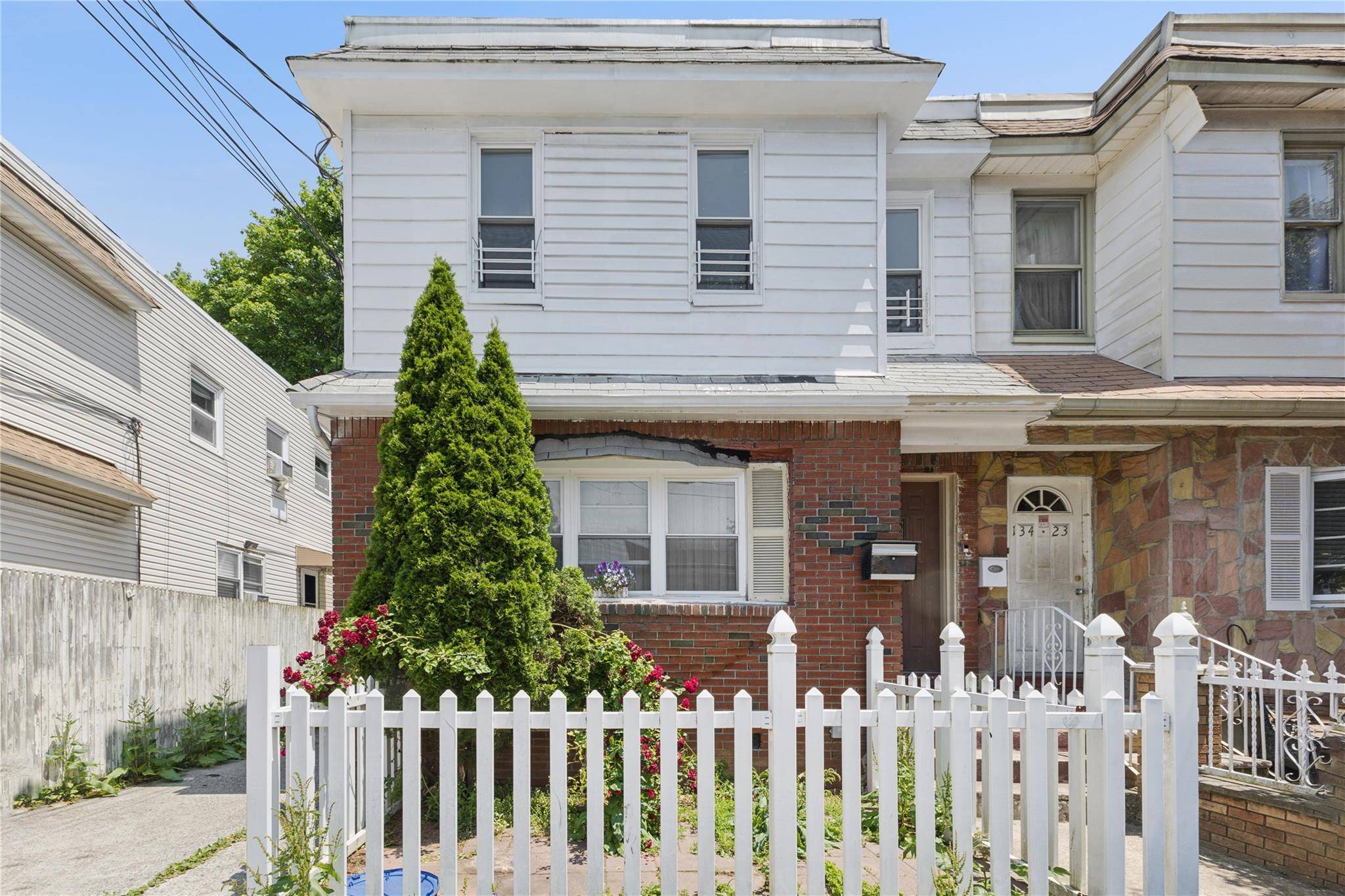 Welcome to 134 21 Hawtree Street a brick legal two family home perfectly situated in the heart of Ozone Park.