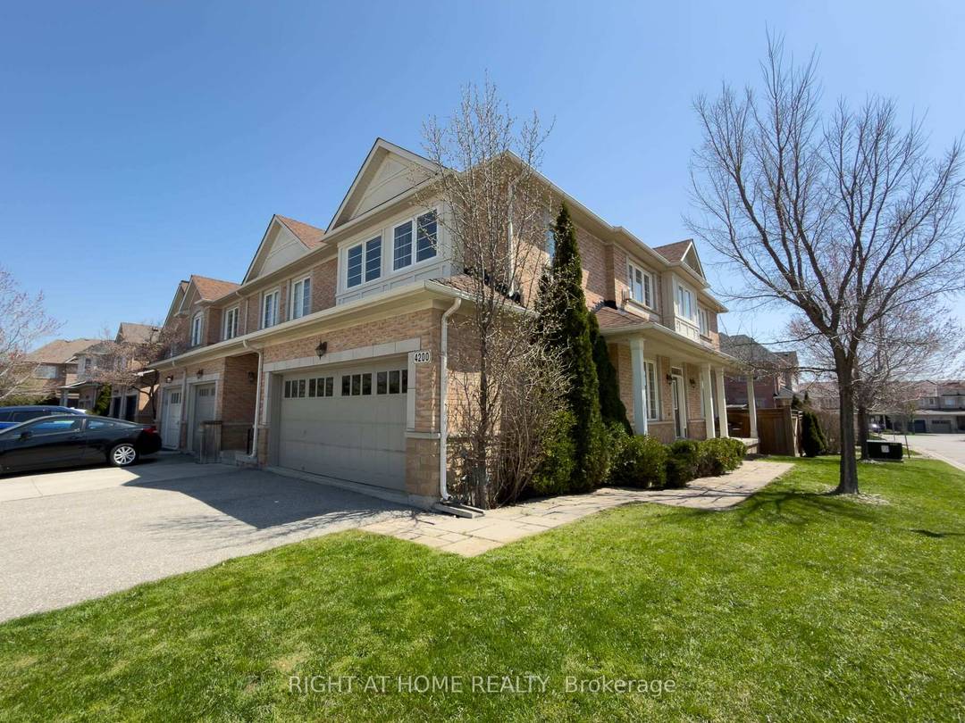 Welcome to this beautifully appointed end unit townhome with a double garage, located in the exclusive Townhomes of Upper Millcroft enclave.