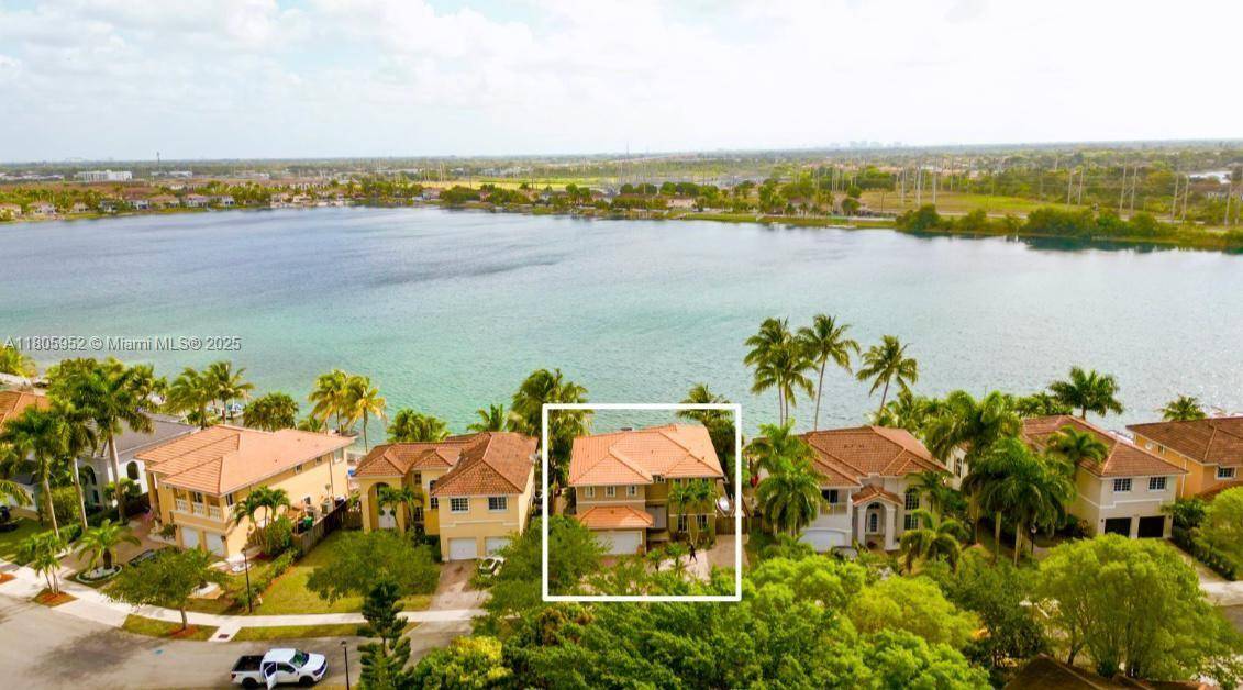 Experience lakefront living in this elegant Giovanna model home in the gated community of Venezia Lakes.