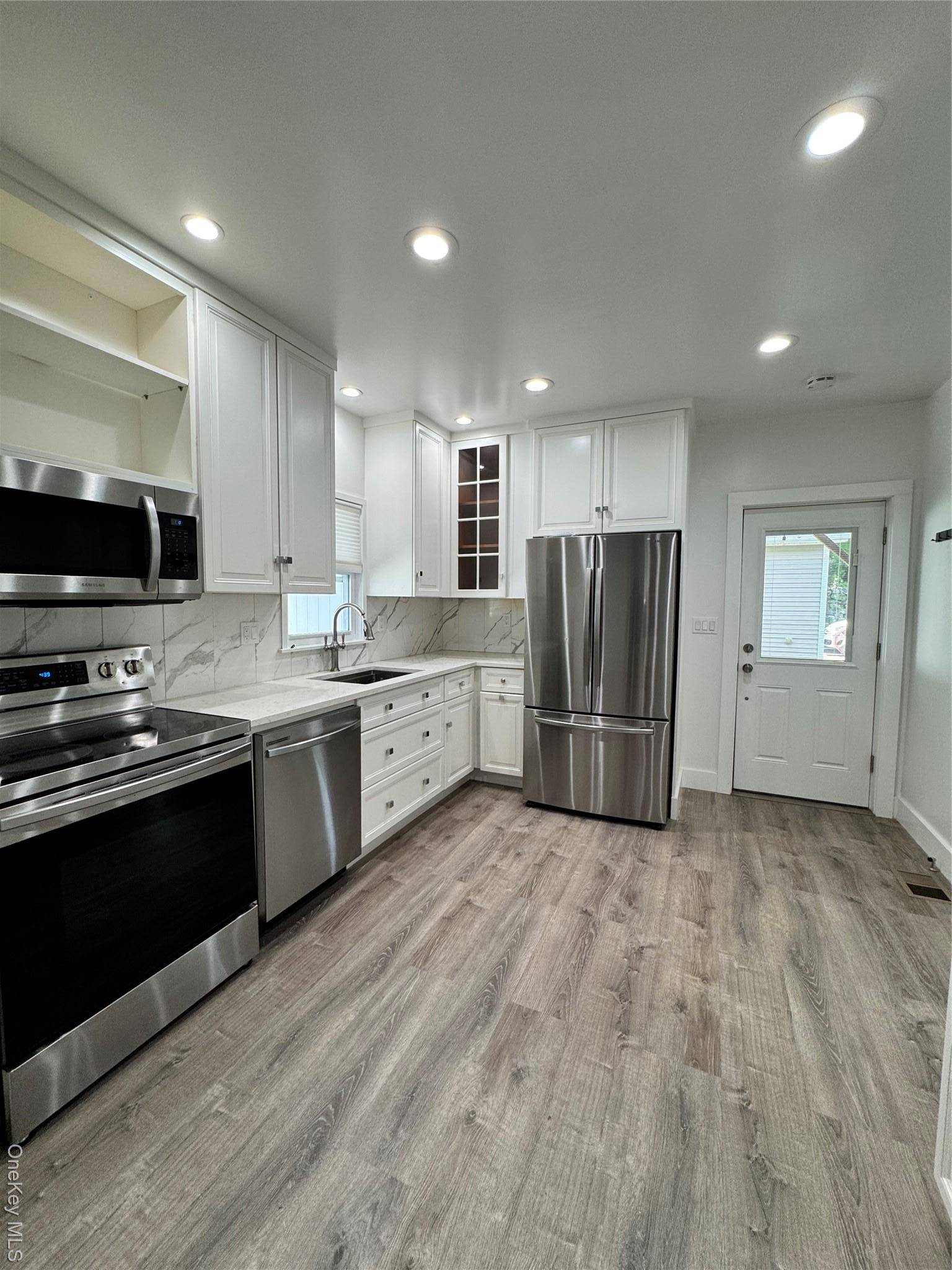Welcome to this beautifully renovated first floor rental in the award winning Rye Neck School District !