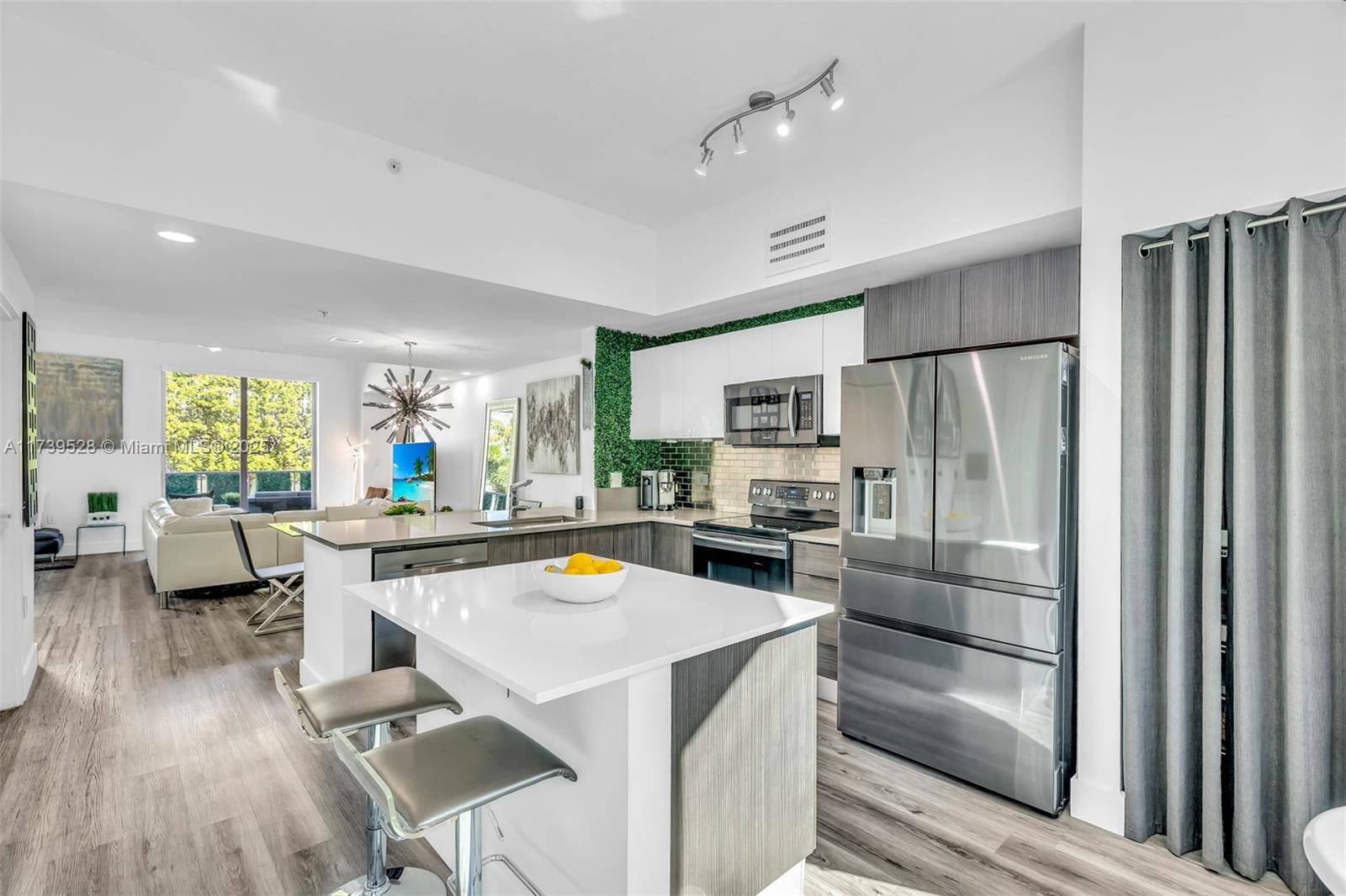 One of a few, Stunning modern 3 story townhome in the heart of vibrant downtown Hollywood.