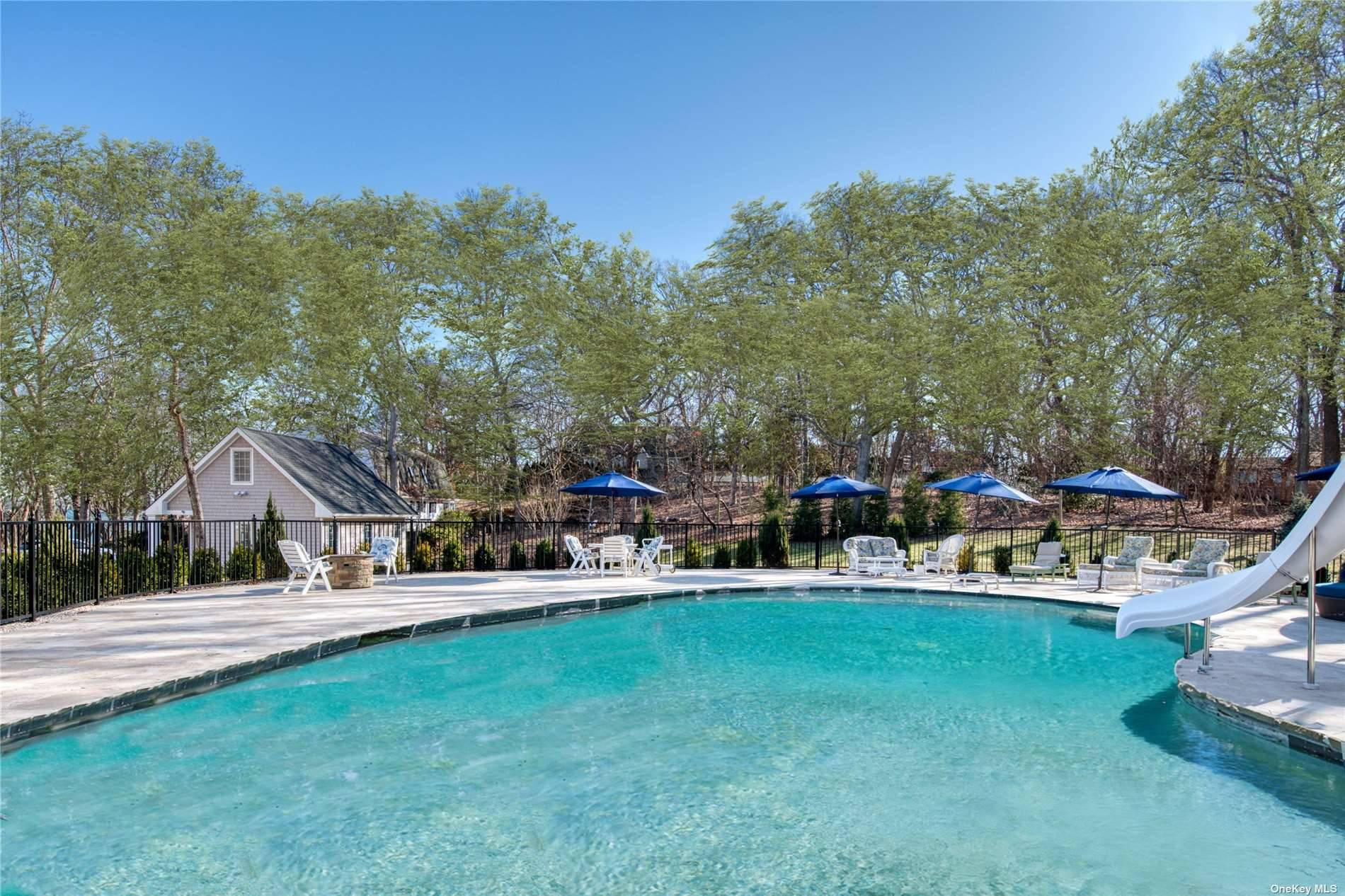 Sprawling Nassau Point estate with open floor plan, 4 ensuite bedrooms and beautiful pool area.