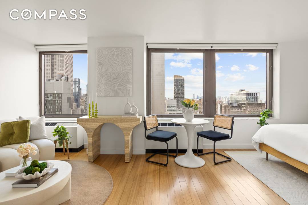 Sun Drenched Alcove Studio with Iconic Skyline Views at the Coveted Bryant Park Tower Condominium.