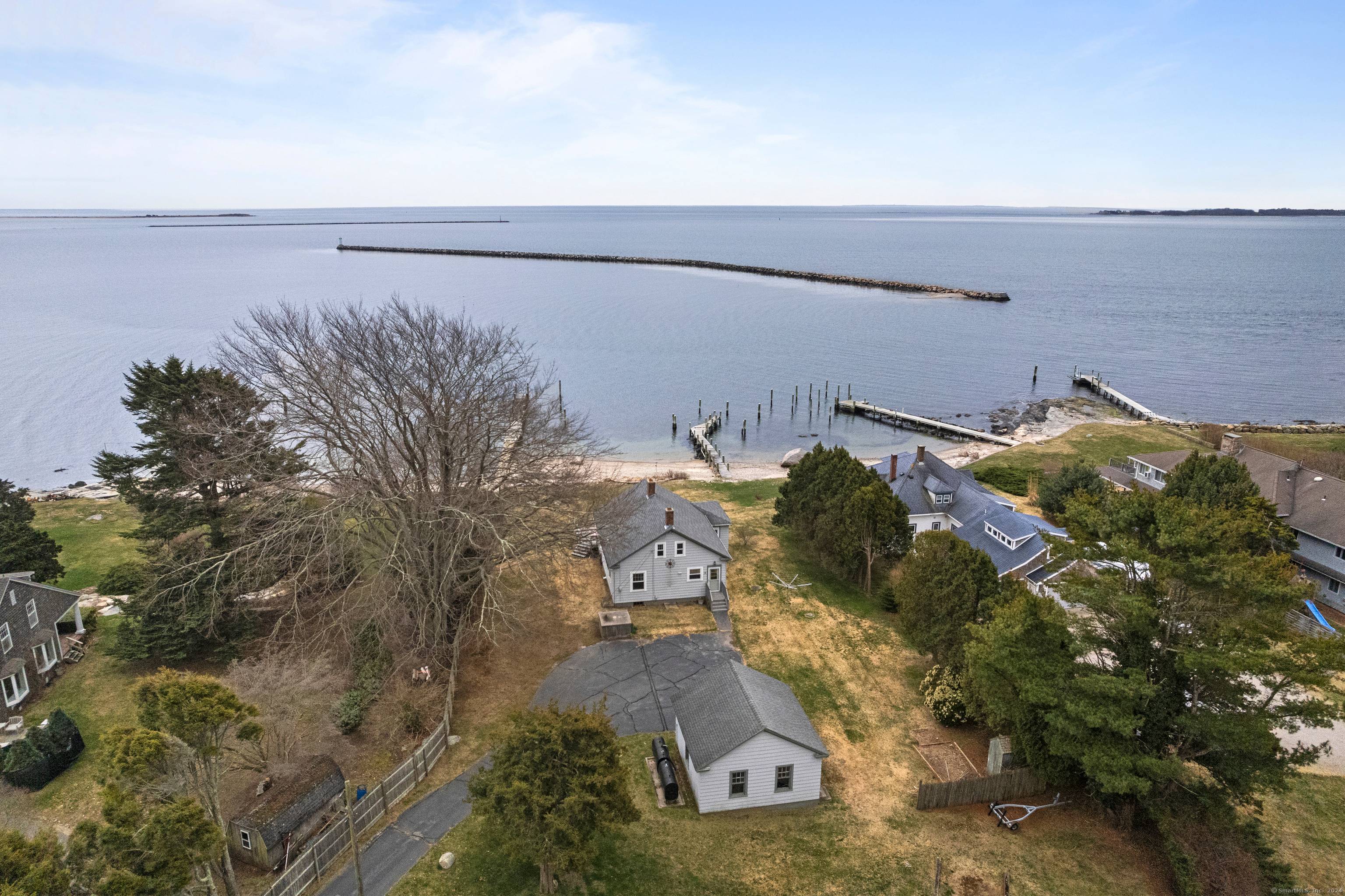 Located on Wamphassuc Point this is an incredible opportunity to own a stunning property with access to a deep water dock, private beach area and tri state water views out ...