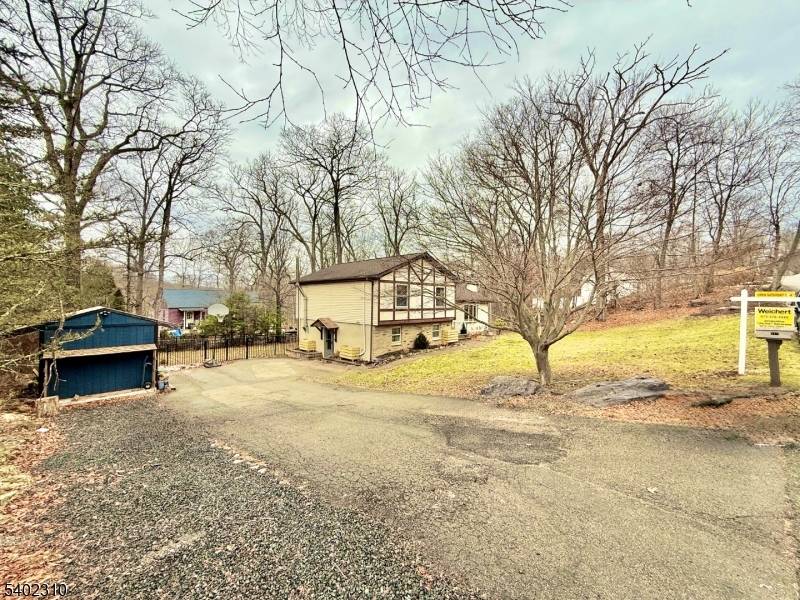 Nestled in the scenic area of West Milford, this inviting split level home offers three comfortable bedrooms, and two full baths.