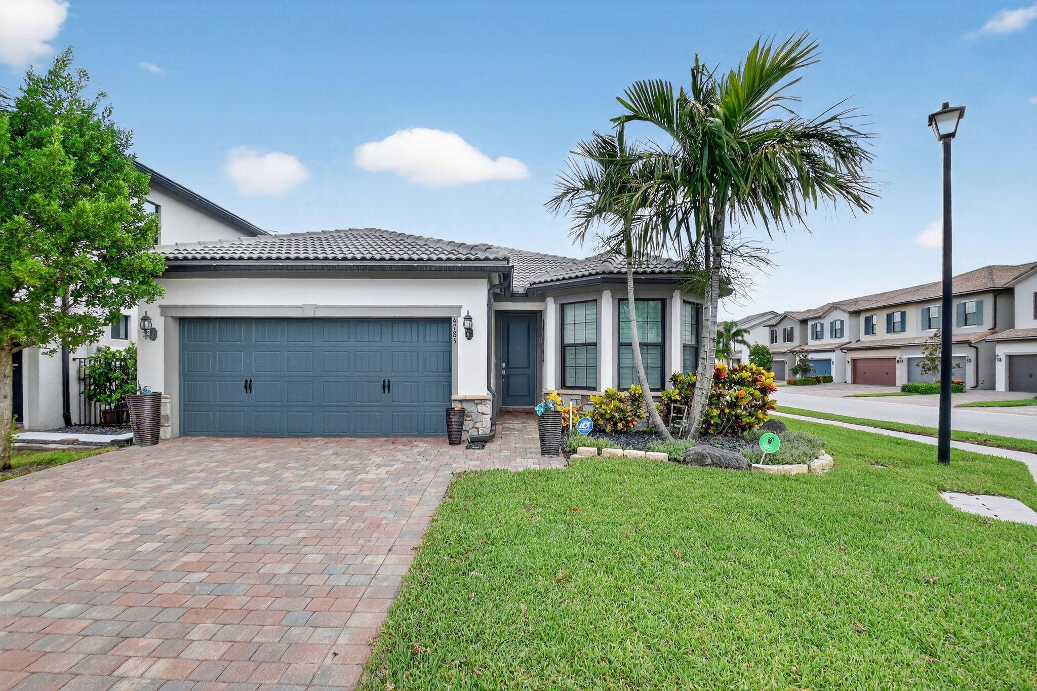Meticulous 3 bedroom 2 bath home corner lot at the Fields in Lake Worth.