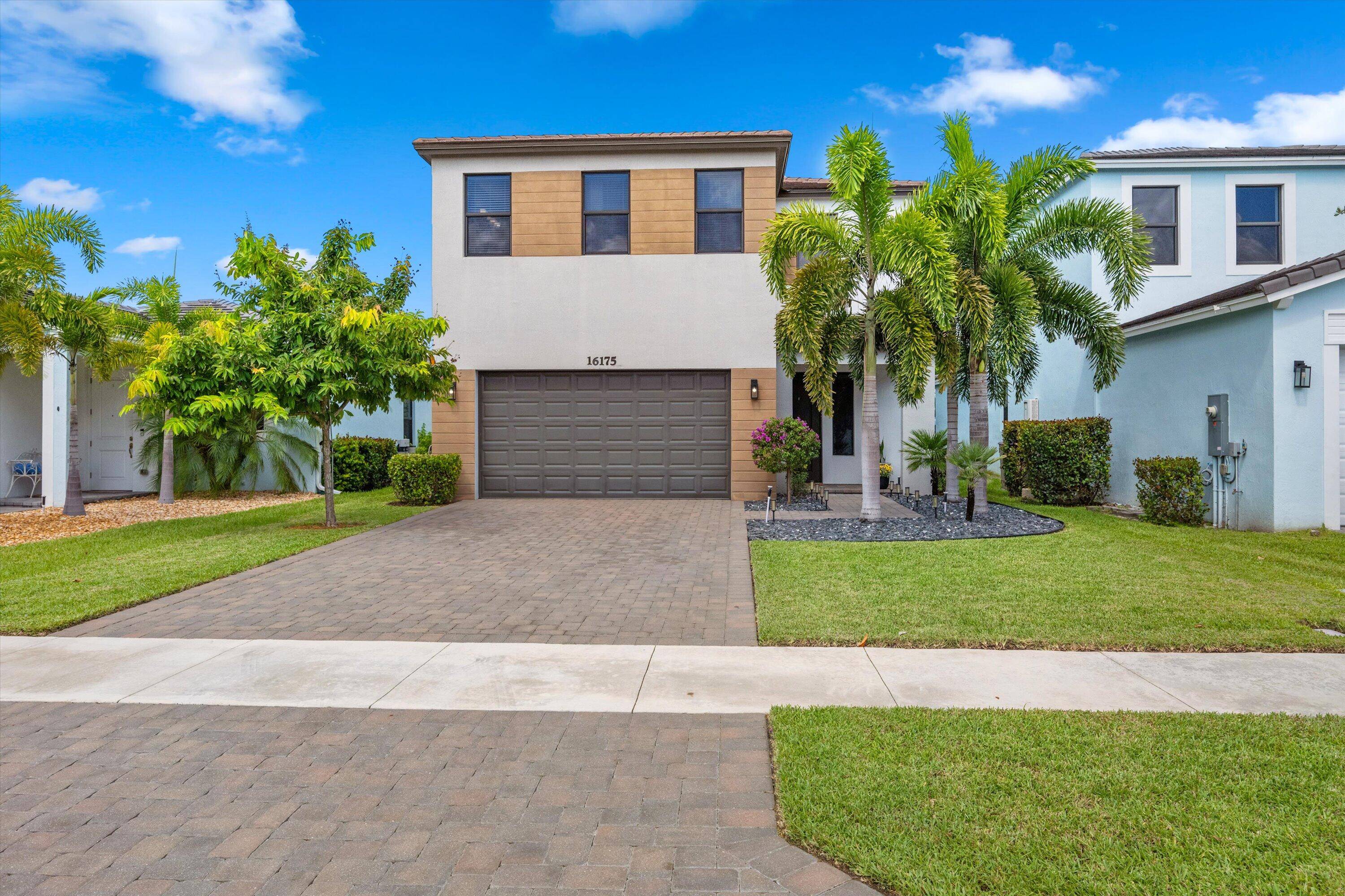 Welcome to this stunning two story home located in the sought after community of Sky Cove in Westlake, FL.
