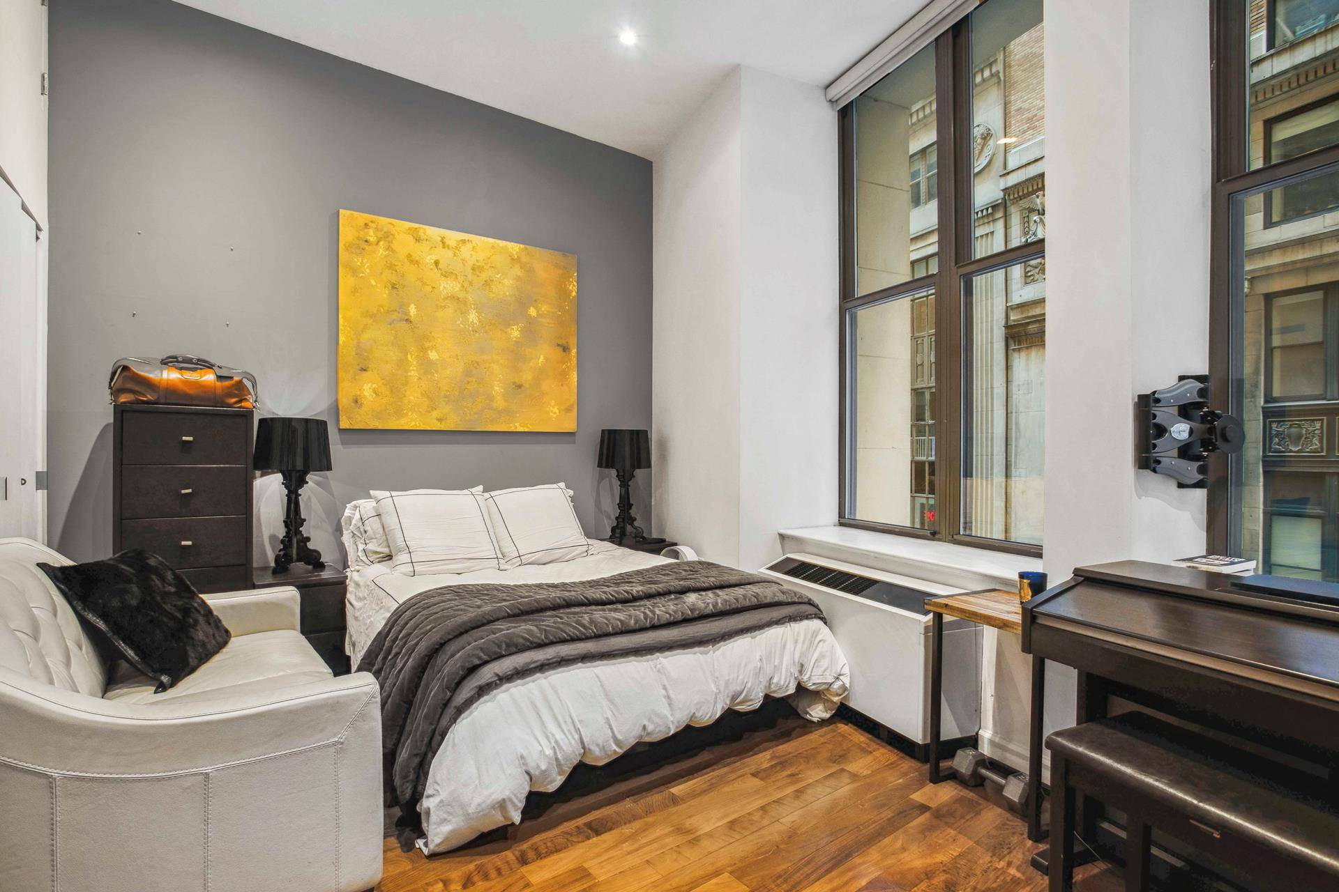 The Cocoa Exchange is home to unit 207, a charming studio featuring 11 foot ceilings.