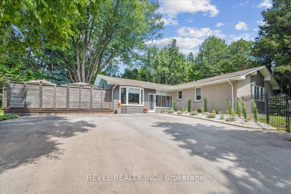 Country in the city ! This custom ranch style bungalow sits on a beautiful.