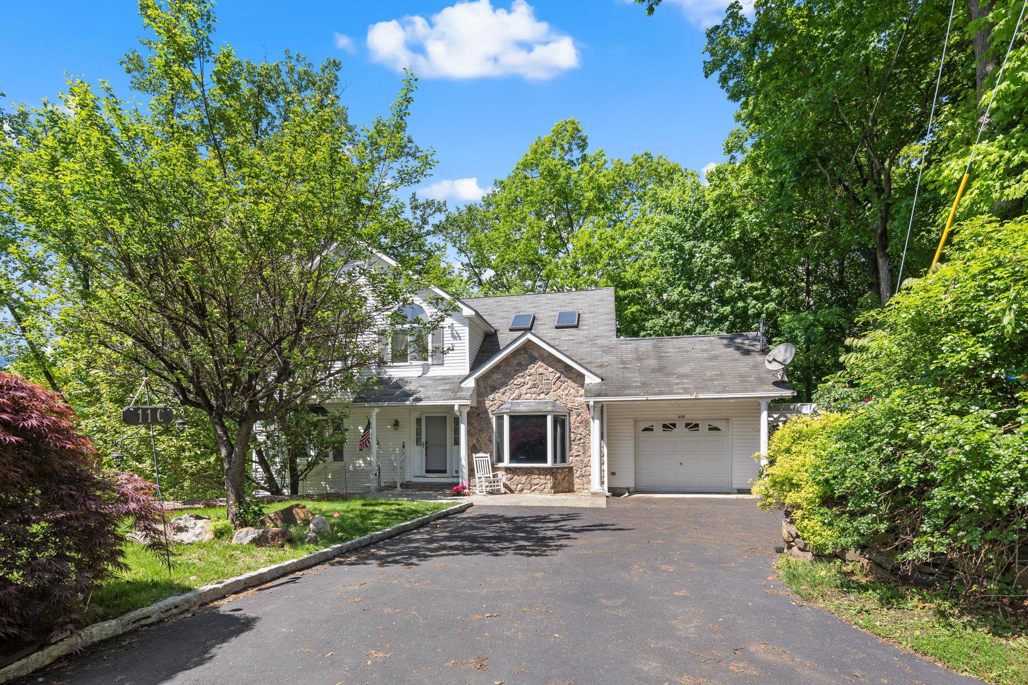 Nestled at the end of the serene and private Piping Rock Drive, this stunning colonial home offers a perfect blend of elegance, comfort, and convenience.