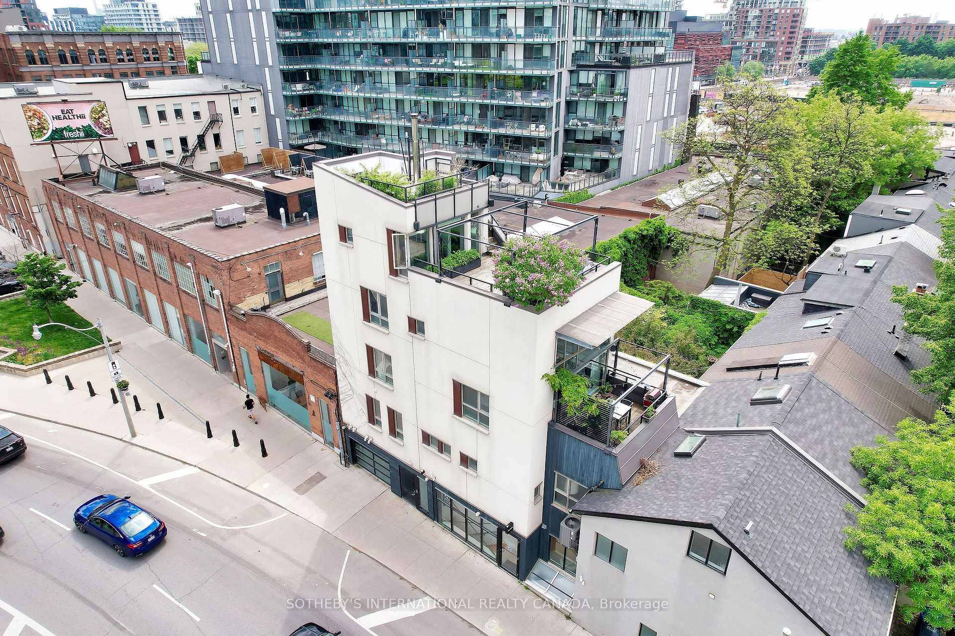 Above the commercial unit, the multilevel townhouse residence offers a striking blend of style and comfort.