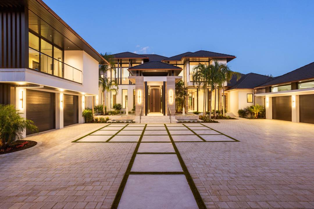 Welcome to 228 Bears Club Drive, a newly constructed masterpiece in the prestigious Bear's Club, Jupiter's premier luxury golf community.