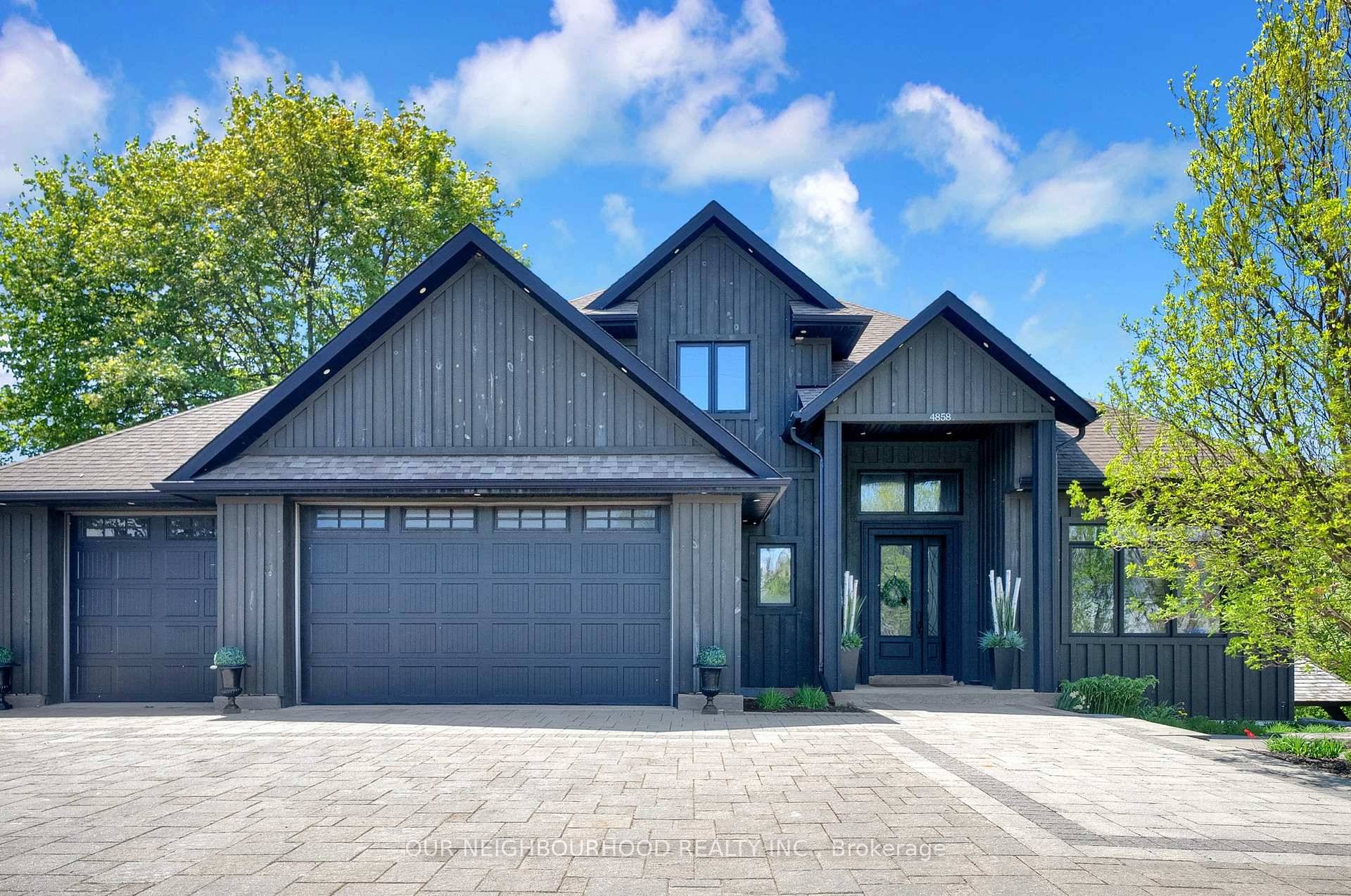 Welcome to 4858 Trulls Rd, an architectural masterpiece that seamlessly blends modern sophistication with timeless elegance.