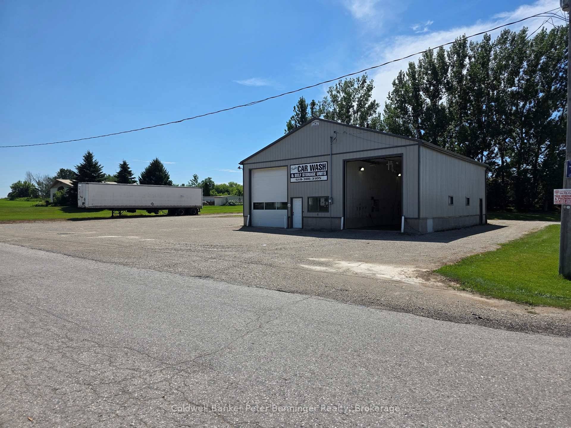 Successful car wash business and automotive shop complex for lease including storage container rentals and extra parking spaces.
