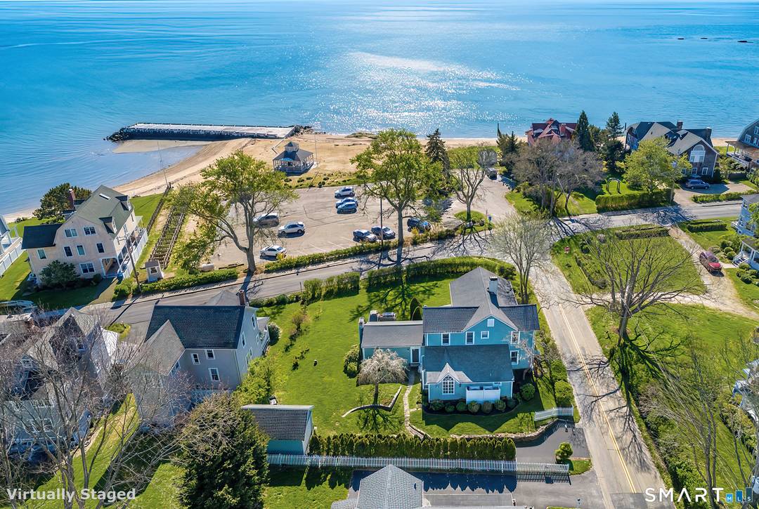 Set along the coveted shoreline of Madison, this pristine coastal retreat seamlessly blends timeless antique charm, the finest modern conveniences and extensive Long Island Sound views.