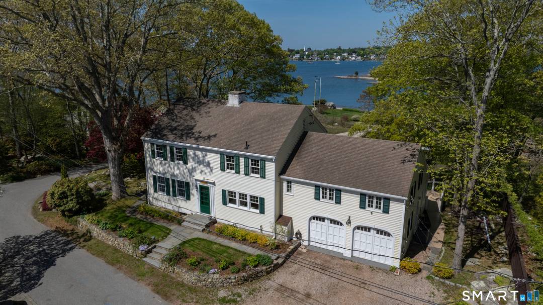 Perched in an exceptional waterfront setting with sweeping panoramic views from the Mystic River to Fisher's Island Sound, this timeless coastal residence offers a rare blend of elegance, comfort, and ...