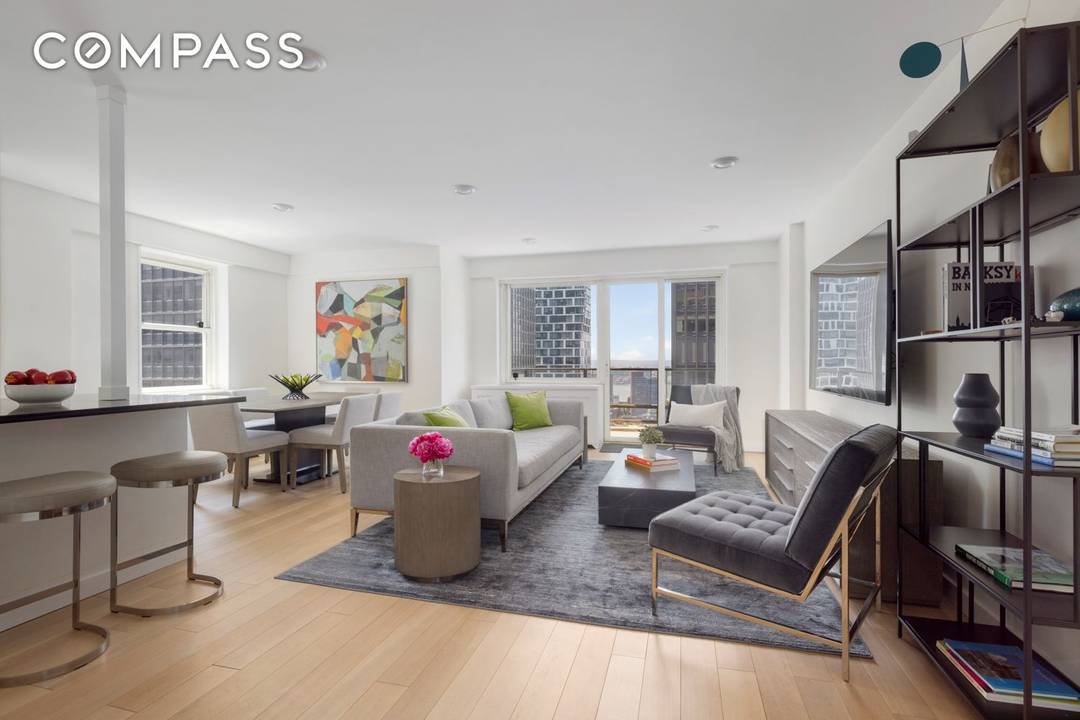 Welcome to this thoughtfully renovated, high floor 2 bedroom and 2 bathroom home in Tower 53 Condominium, a full service condominium in the heart of Midtown Manhattan.
