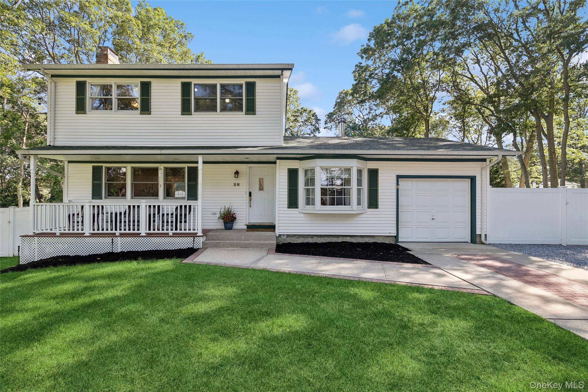 Welcome to this beautifully maintained Colonial set on nearly half an acre in Holbrook.