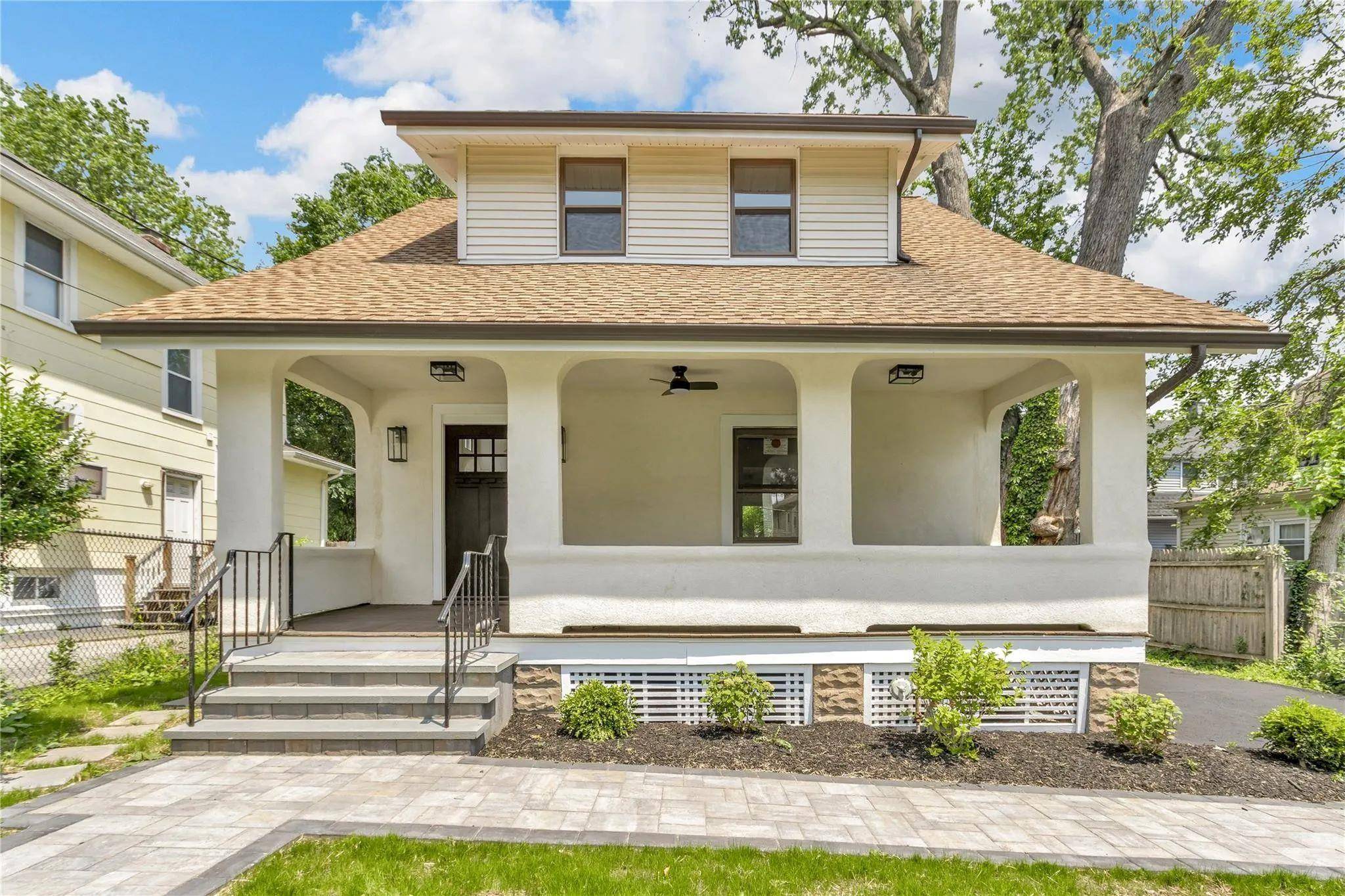 Welcome to a masterfully renovated Circa 1910 Farmhouse Colonial in the heart of coveted Nyack village.