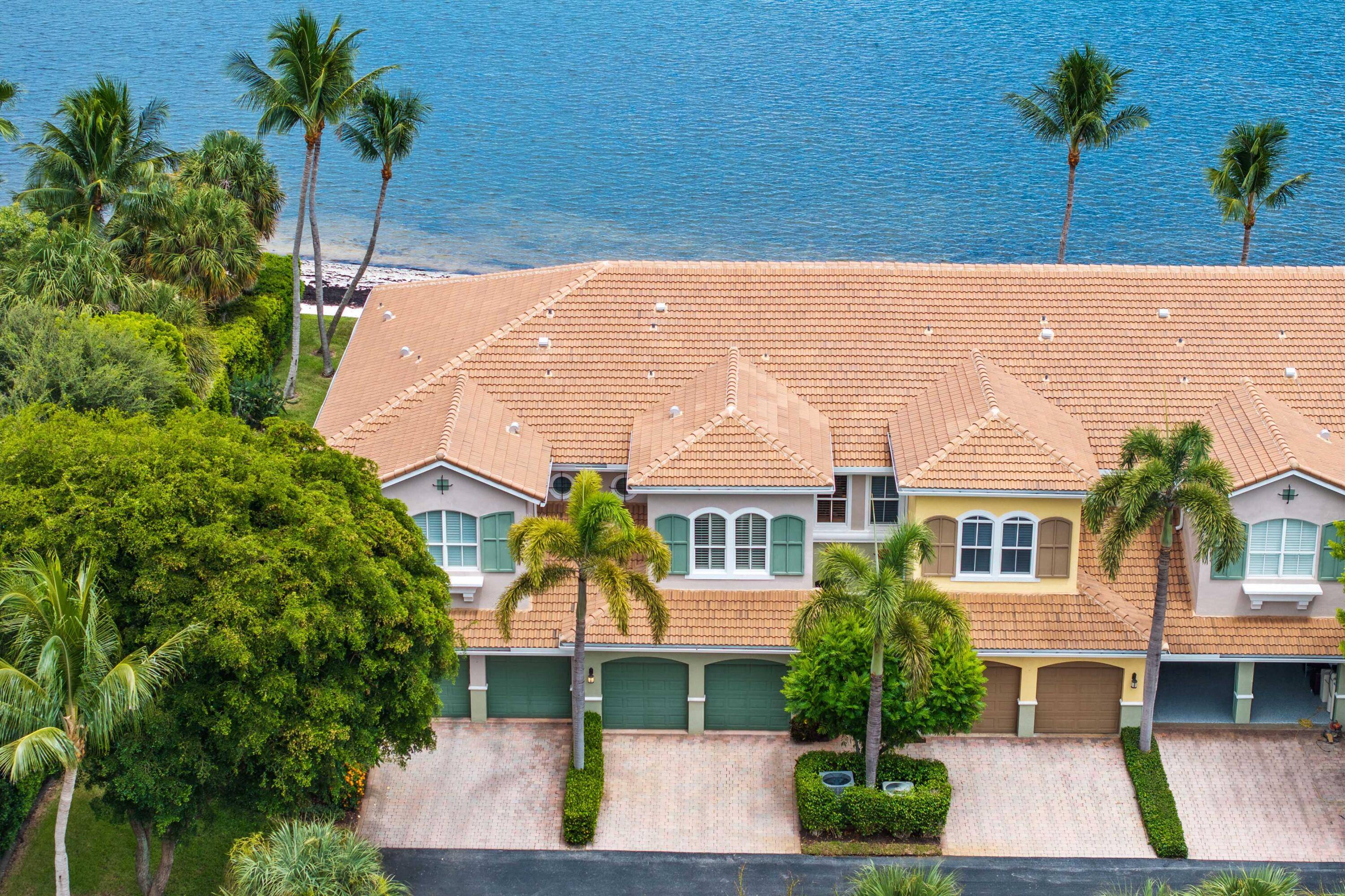 Welcome home to this RARELY AVAILABLE private beachfront townhome perched directly on the sandy shores of the Intracoastal perfect for enjoying South Florida's indoor outdoor lifestyle.