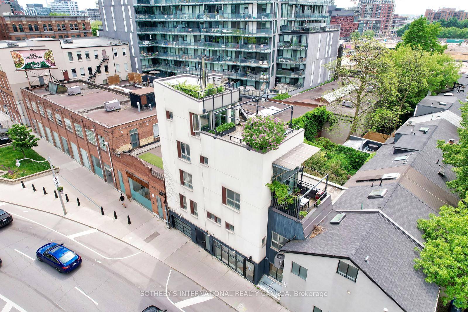 Above the commercial unit, the multilevel townhouse residence offers a striking blend of style and comfort.