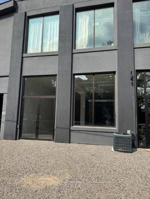 Main floor private entrance studio office retail, 13 ft ceilings, bright with epoxy floors