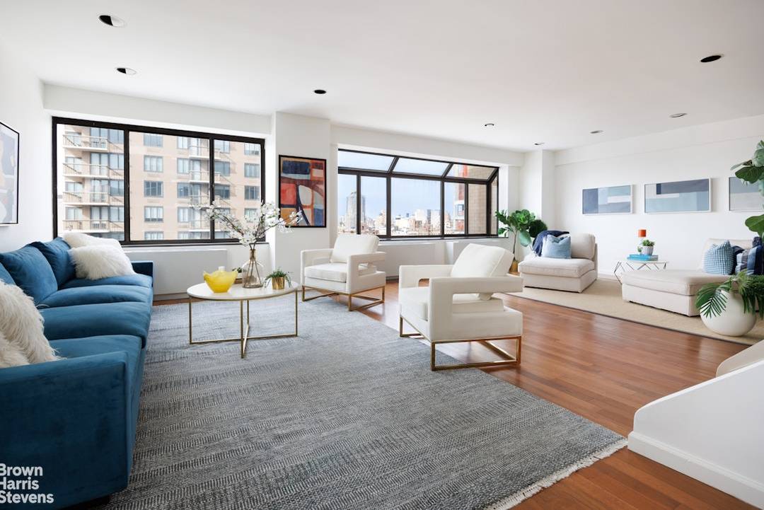 Sun flooded penthouse duplex condominium with 3 private outdoor paces, including a sprawling second floor terrace measuring 38' x 10'7, overlooking the New York City skyline !