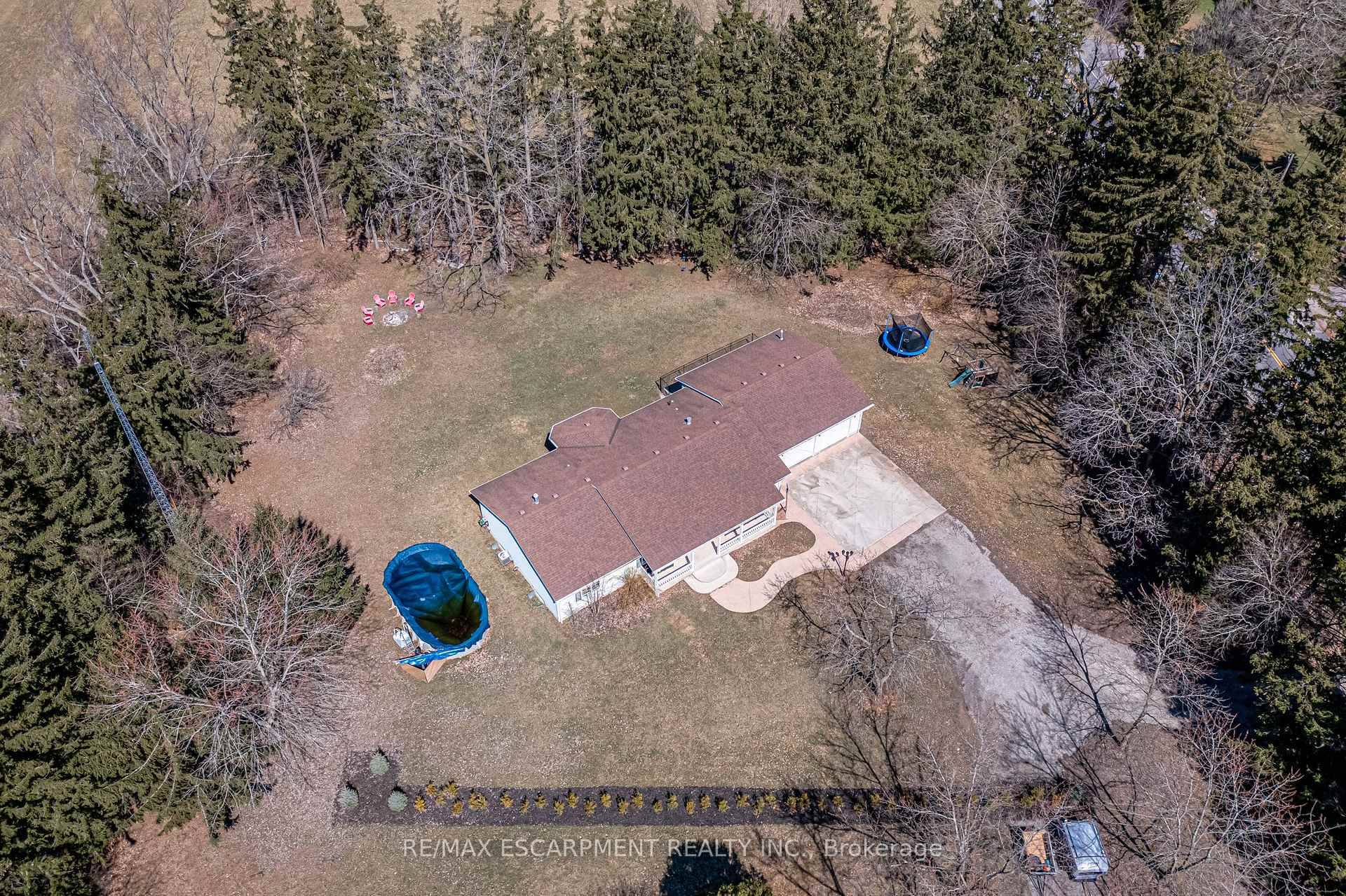 Tucked behind a canopy of trees, this stunning ranch bungalow offers modern farmhouse charm and ultimate privacy.
