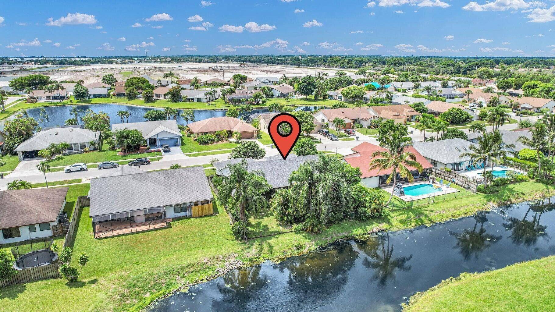 Charming four bedroom two bath home with bonus room in West Boca Raton.