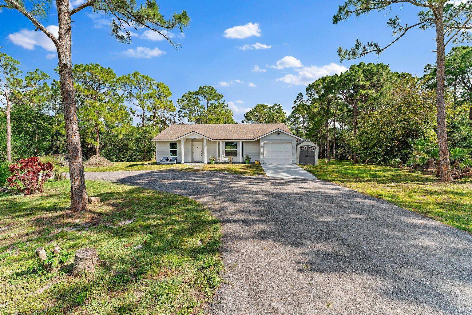 Welcome home to this fully renovated 3 bedroom, 2 bathroom home nestled on 1.