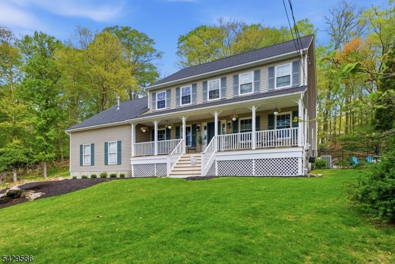 Impeccably maintained Colonial with deeded boat slip and private putting green in Jefferson Twp, offering the ideal blend of lake living and everyday comfort on a super private no traffic ...