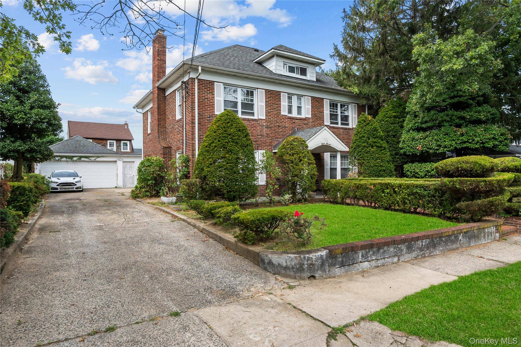 Welcome to 311 Hamilton, a 4 bedroom, 3 bathroom Brick Center Hall Colonial located on an expansive 80x100 lot in a prime Hewlett neighborhood.