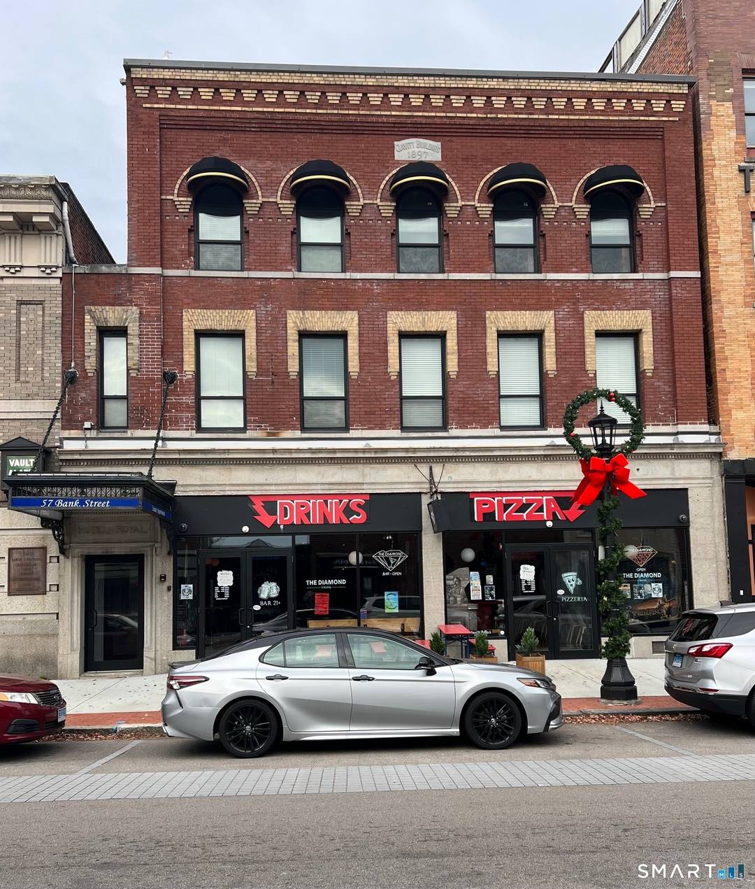 Mixed use property with 1 commercial unit and 8 apartments located in the heart of downtown New London.