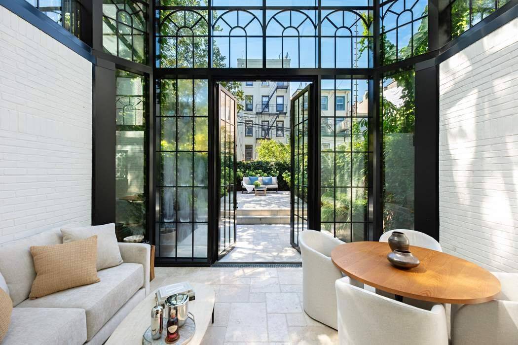 Park Slope Perfection ! A meticulously renovated 1901 townhouse on an idyllic tree lined street, only 2 blocks from Prospect Park.