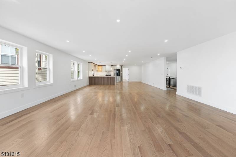 Welcome to this stunning newly constructed side by side luxury multi family residence situated on an oversized 50x100 lot, where elevated design meets modern living.