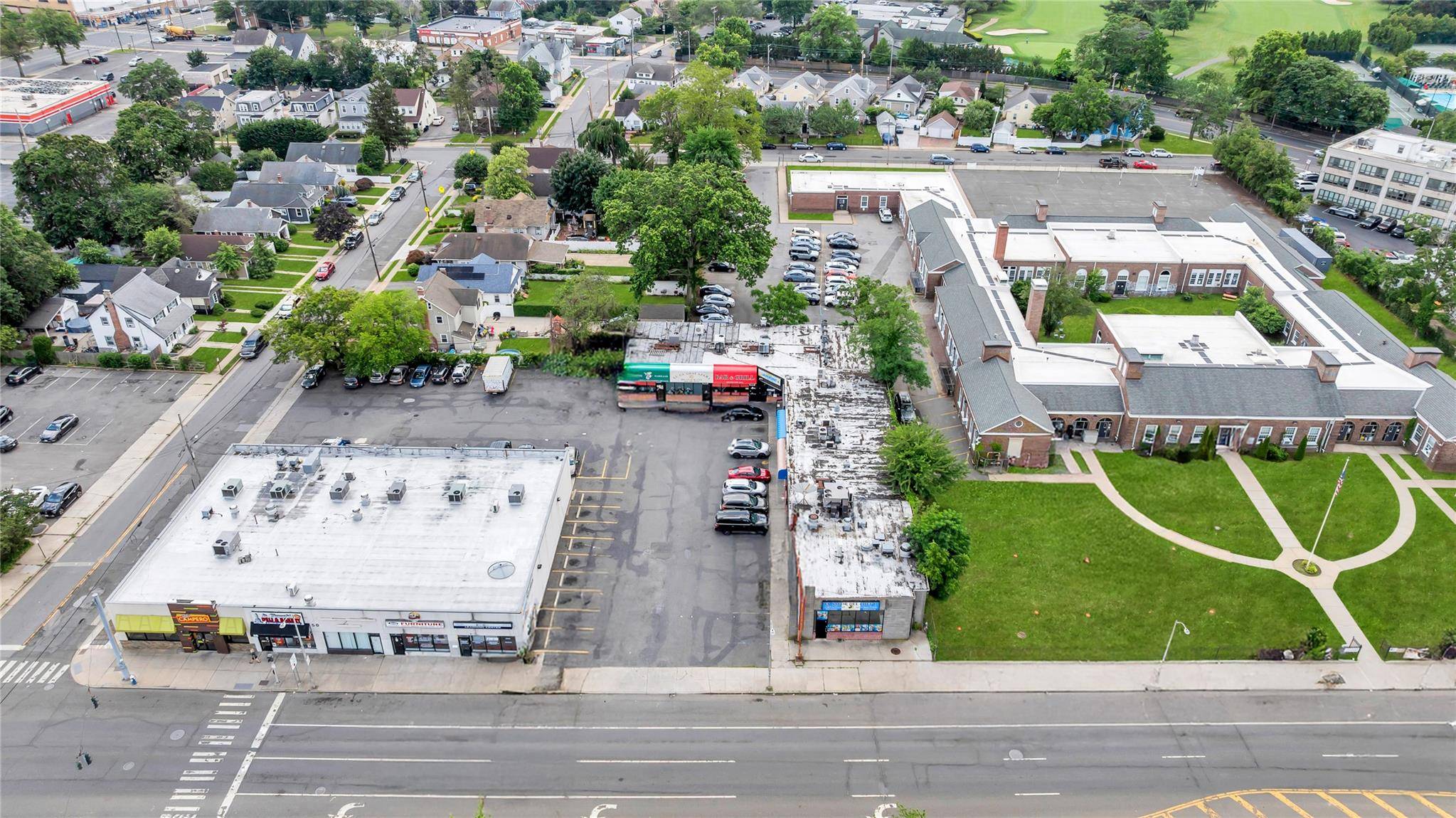 Prime Hempstead strip mall investment opportunity featuring two well maintained commercial buildings totaling approximately 17, 500 sq ft of retail space on a 0.