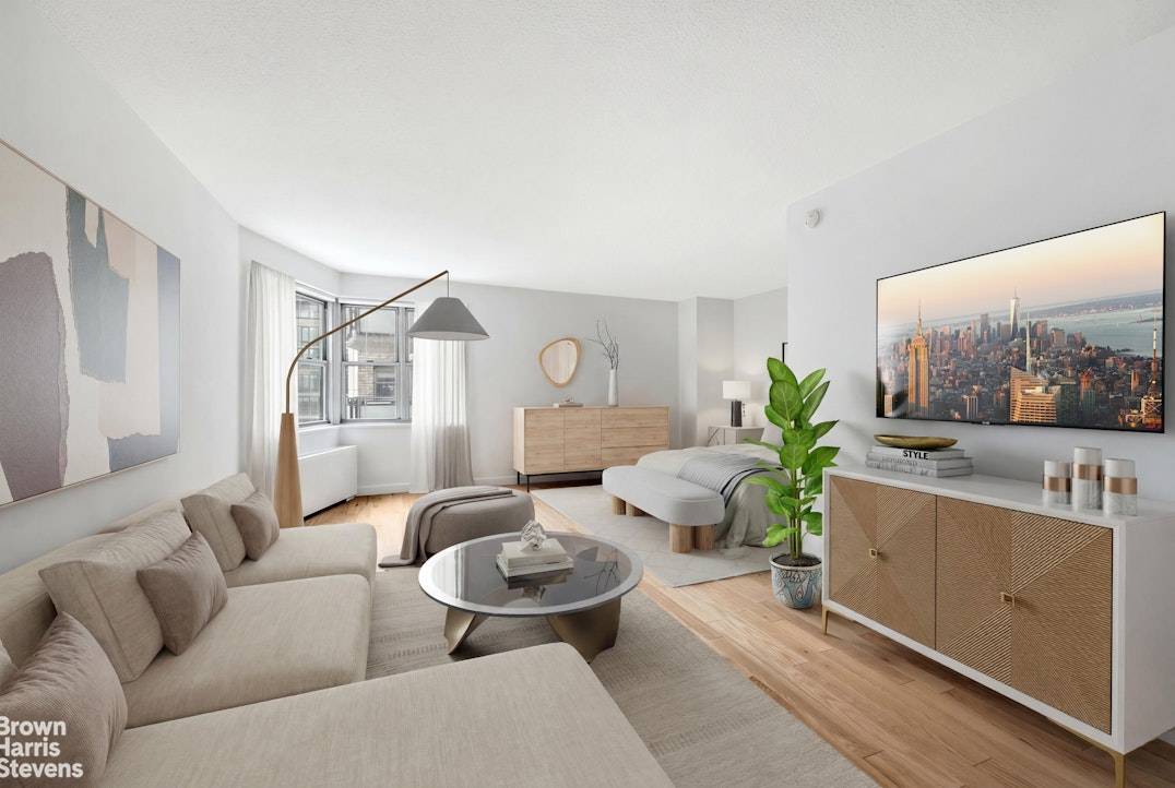 High floor corner studio with south western exposure offering great light and city views.