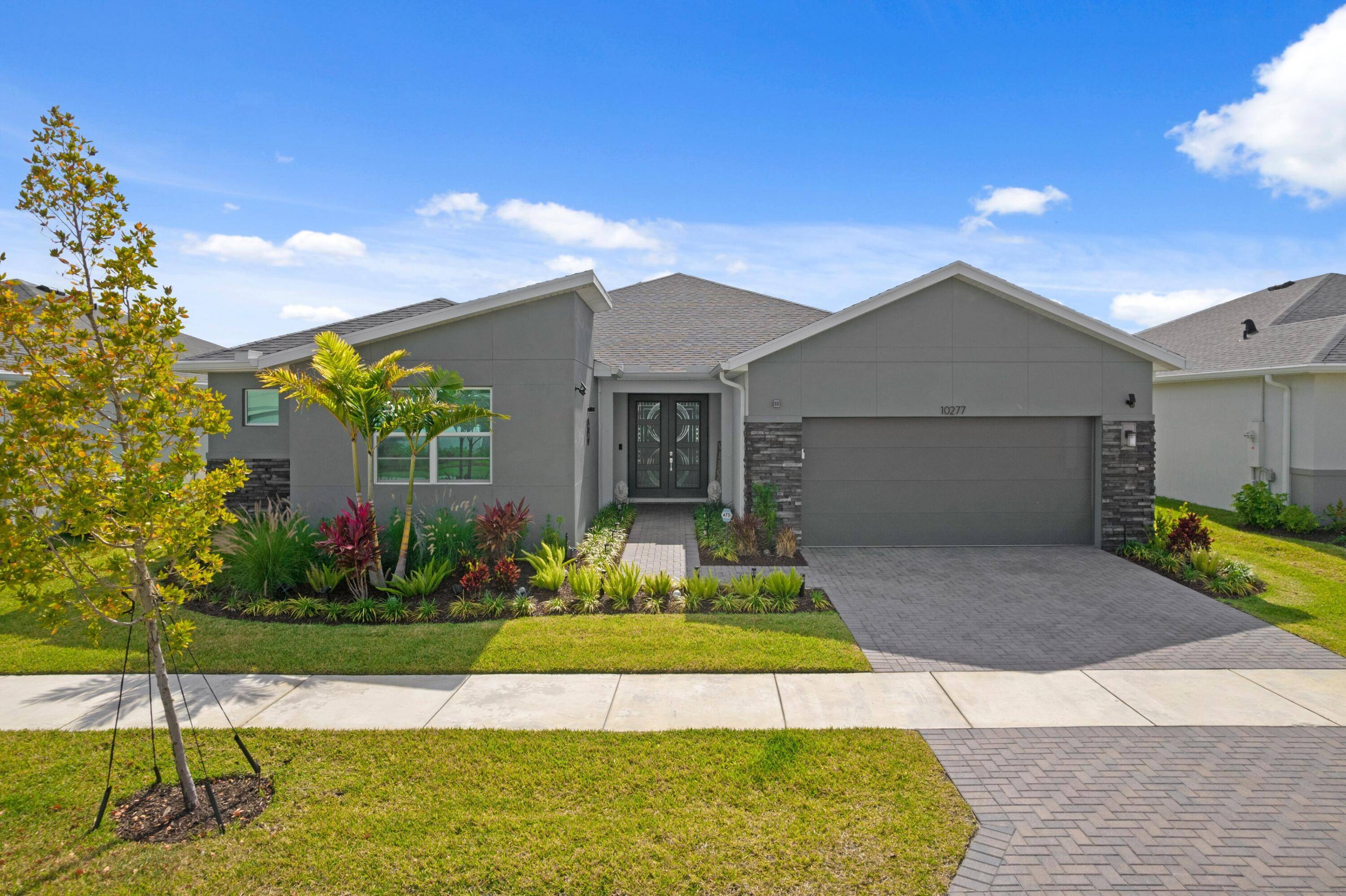 ABSOLUTELY GORGEOUS WATERFRONT SINGLE FAMILY HOME 2024 NEW CONSTRUCTION EXQUISITE HIGH END QUALITY CONSTRUCTION WORKMENSHIP OVERSIZED LOT PRESTIGIOUS GATED COMMUNITY OF CADENCE BREATHTAKING LAKE VIEWS Bright Open Floor Plan Grand ...