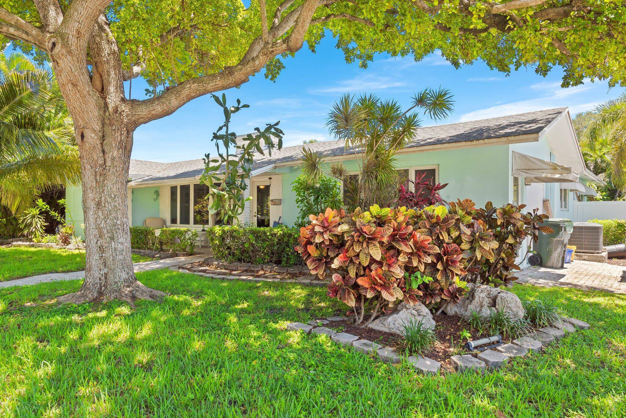 Tropically updated, stylish 3 2 pool home on a corner lot in desirable Palmetto Park Terrace.