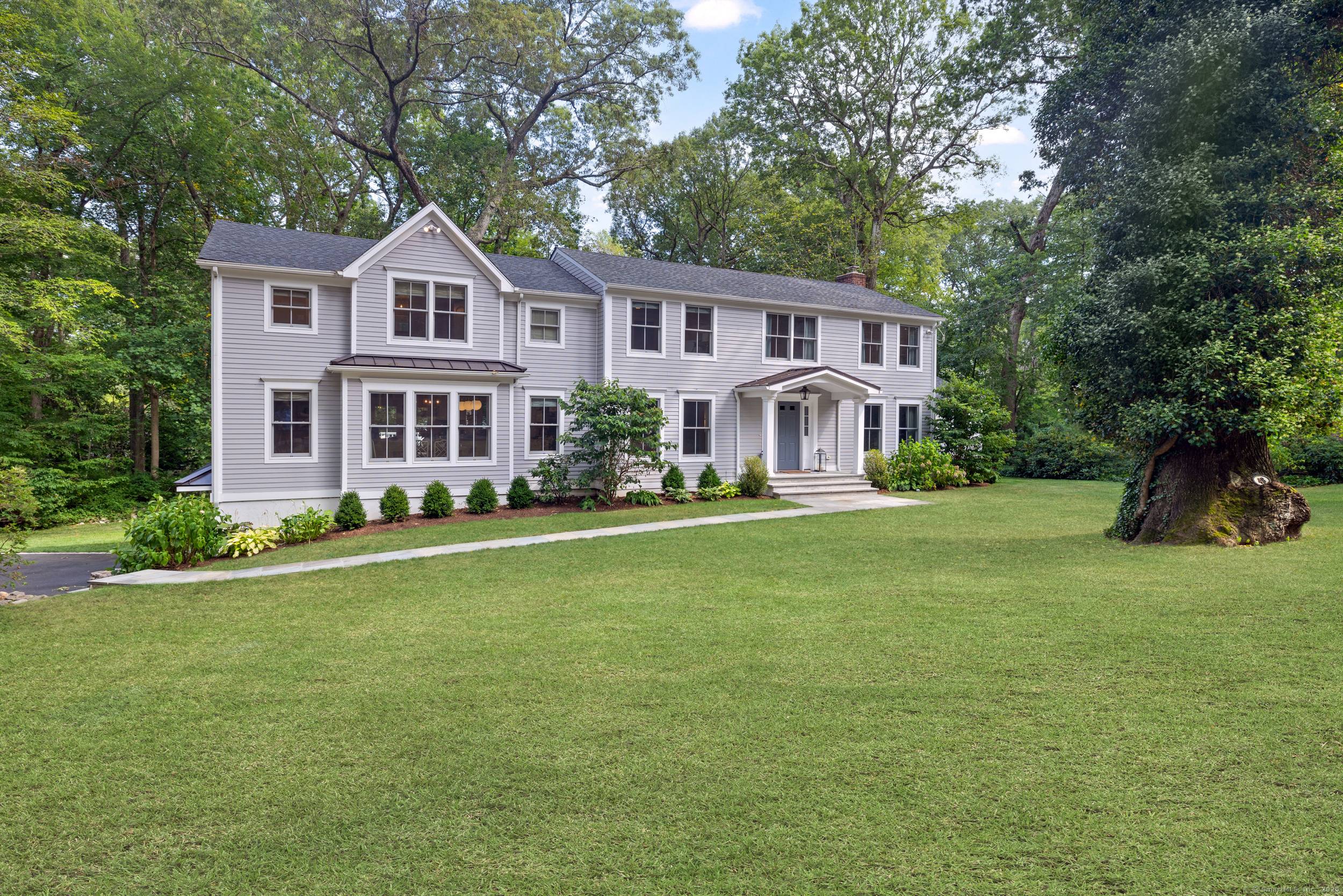 This beautifully renovated colonial, rebuilt in 2019, offers a perfect blend of classic charm and modern luxury in a highly sought after neighborhood.