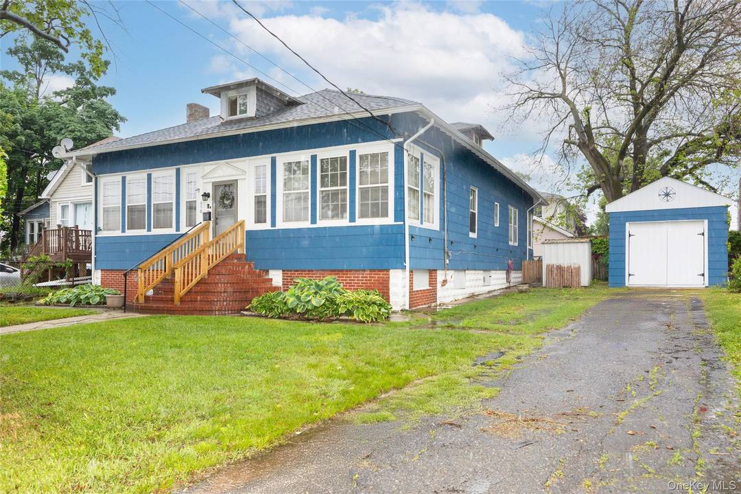 Nestled just beyond the bridge, this charming ranch style home presents a fantastic opportunity to create your dream living space.