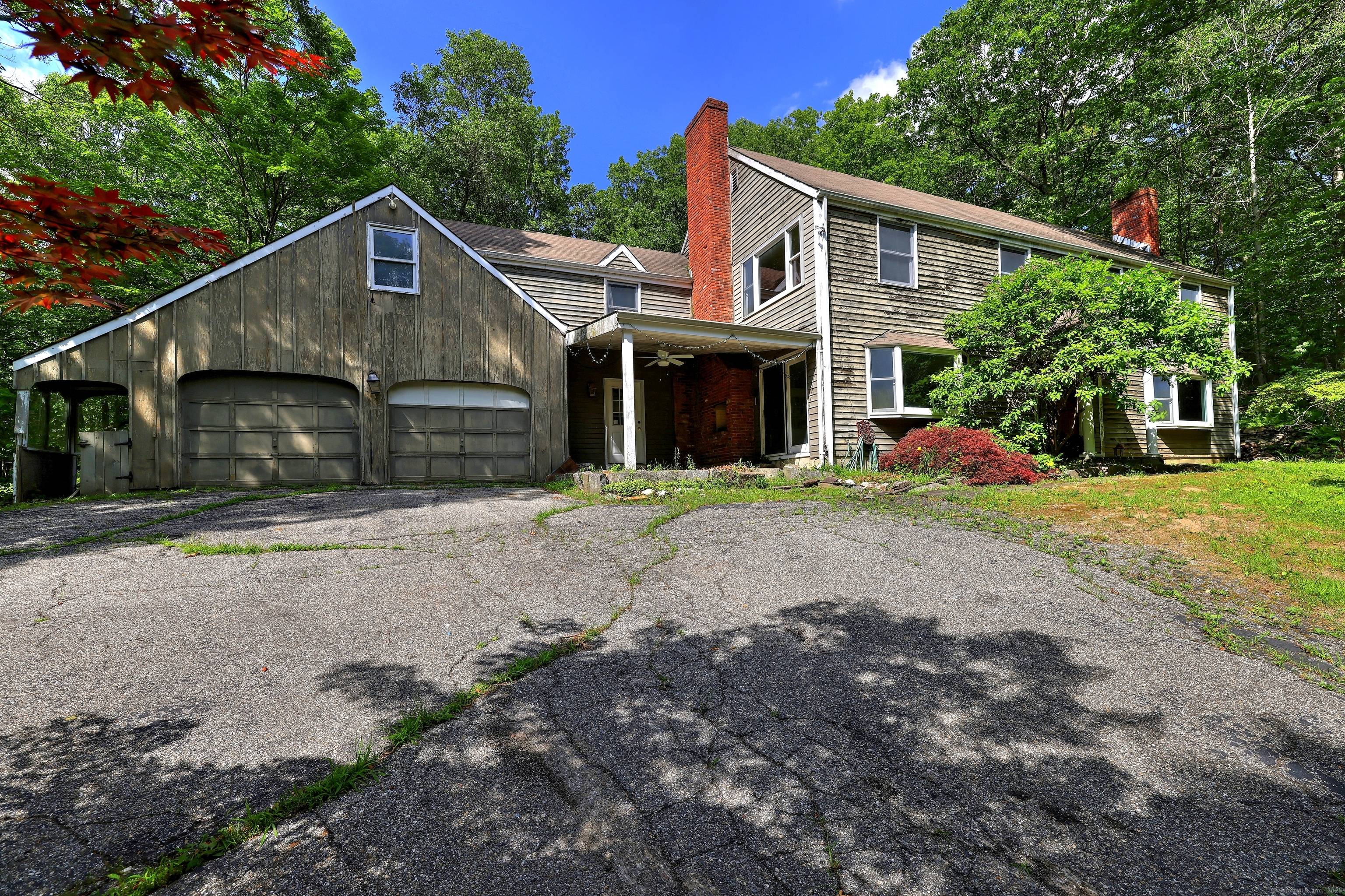 Meander up the curved driveway to your secluded 6.