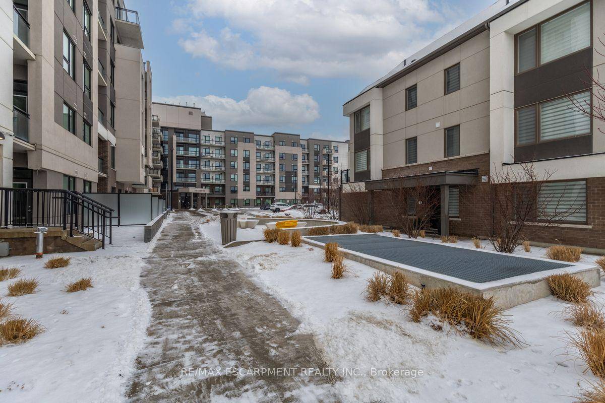 Welcome to Suite 211 at 1105 Leger Way a stylish 1 bedroom, 1 bathroom condo that blends modern design with urban convenience in the heart of Milton.