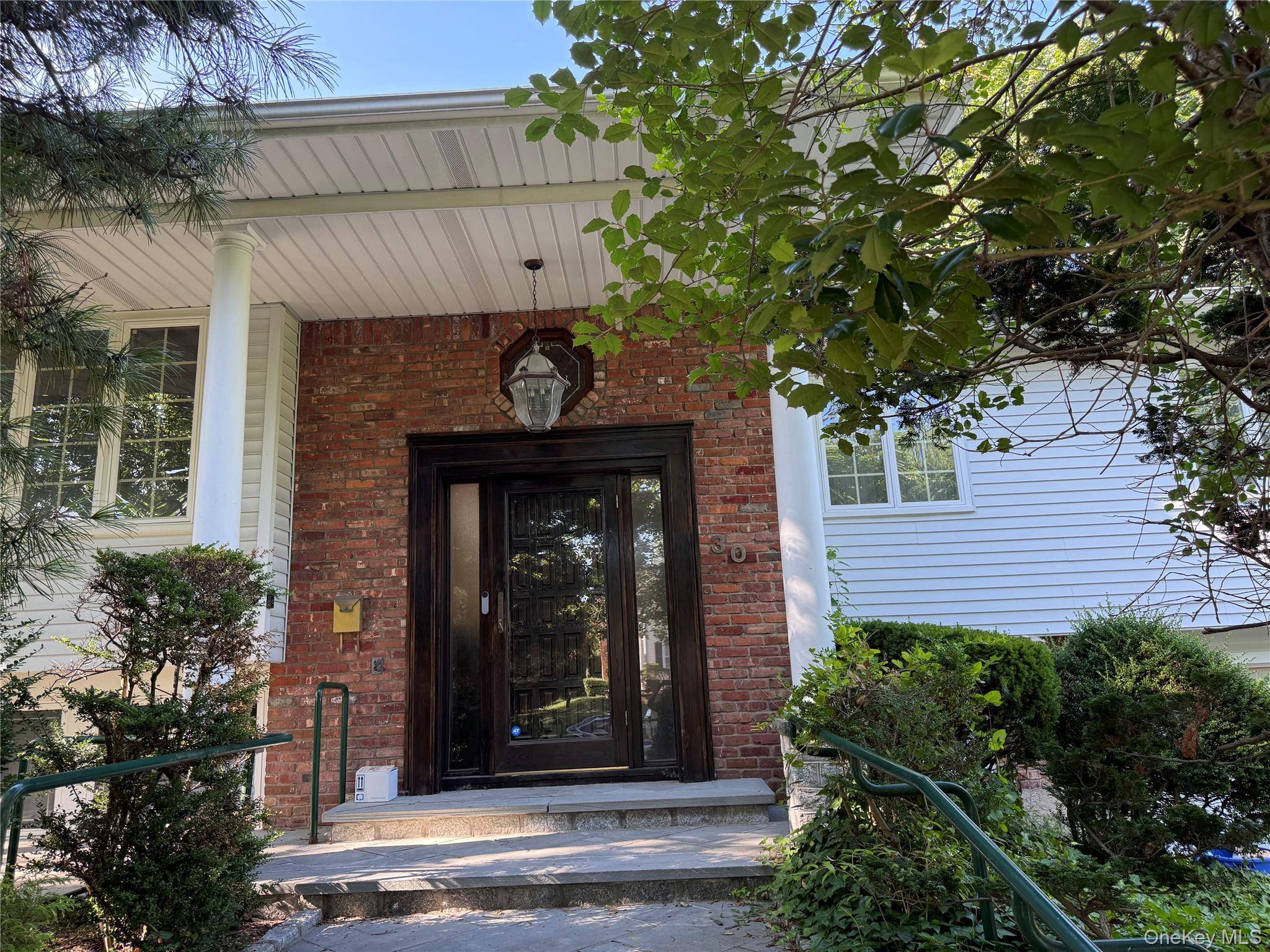 Welcome to this extraordinarily large residence, boasting an impressive stone and brick pillars lighted entryway.