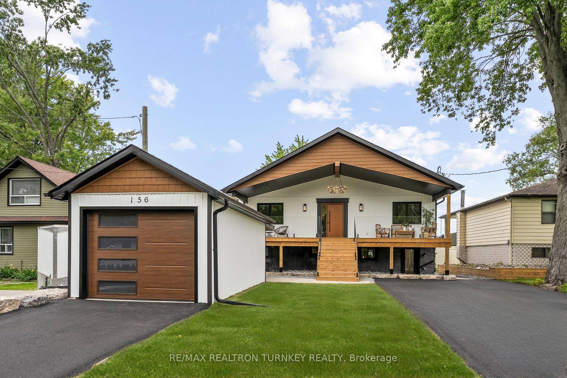 This stunning, completely rebuilt custom bungalow on Holmes Point offers 50ft of direct waterfront and 2052 sqft of finished living space with a rare custom boathouse, detached garage, and impeccable ...