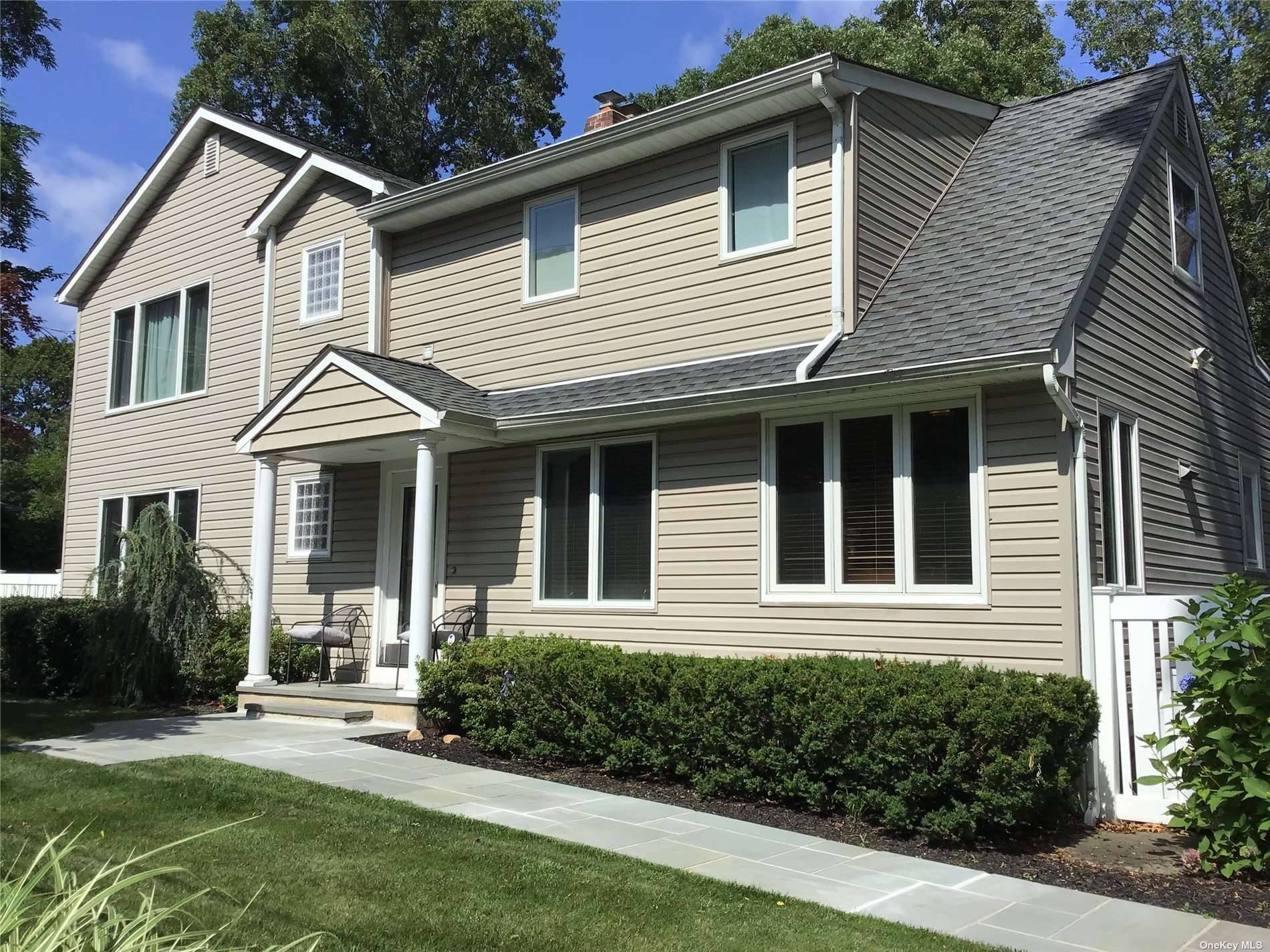 This Spacious Colonial Home is a Stone's Throw to the Private Beach with beach rights.