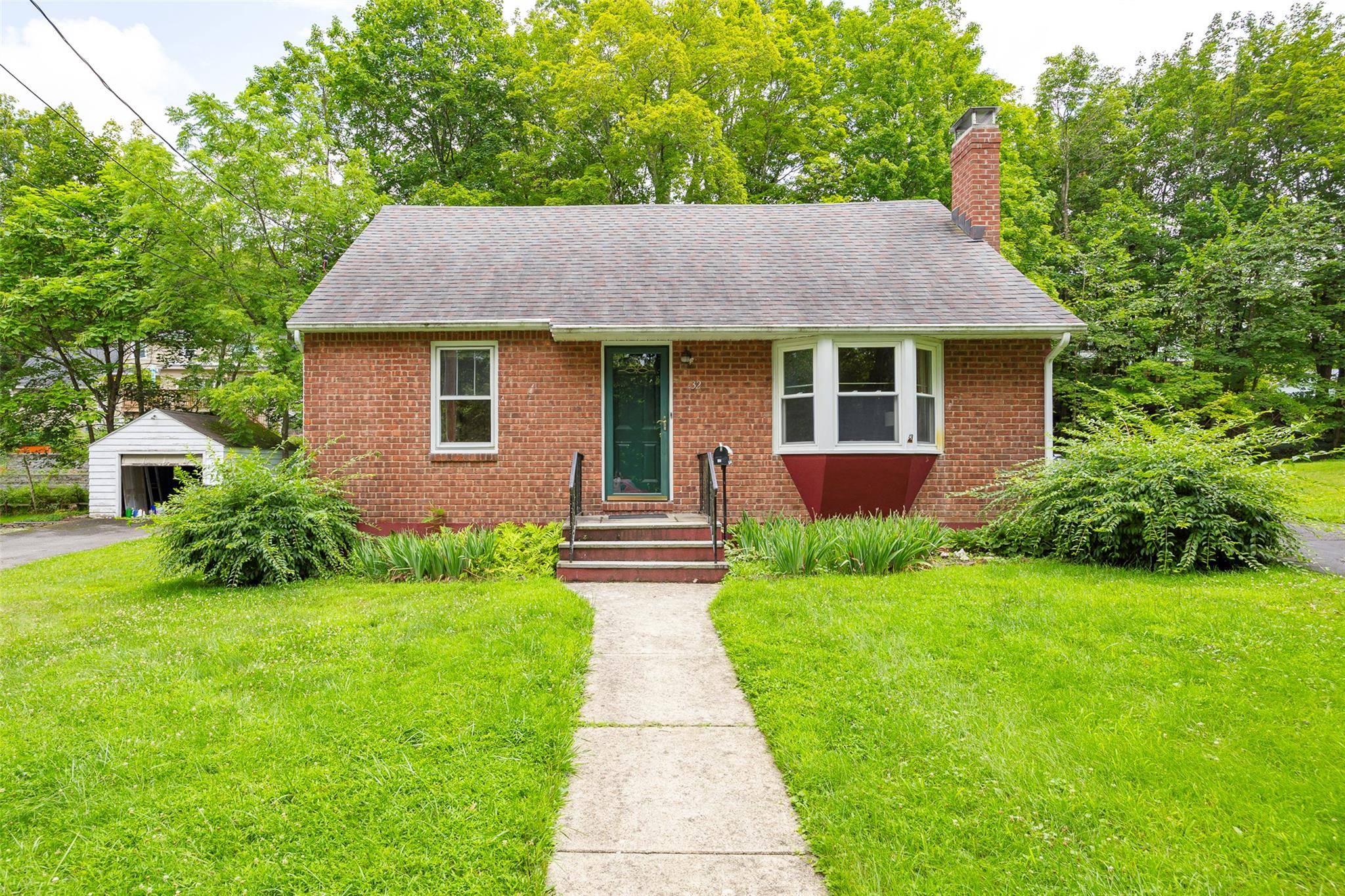 Welcome to this beautifully maintained brick faced Cape Cod in the heart of the Village of New Paltz.