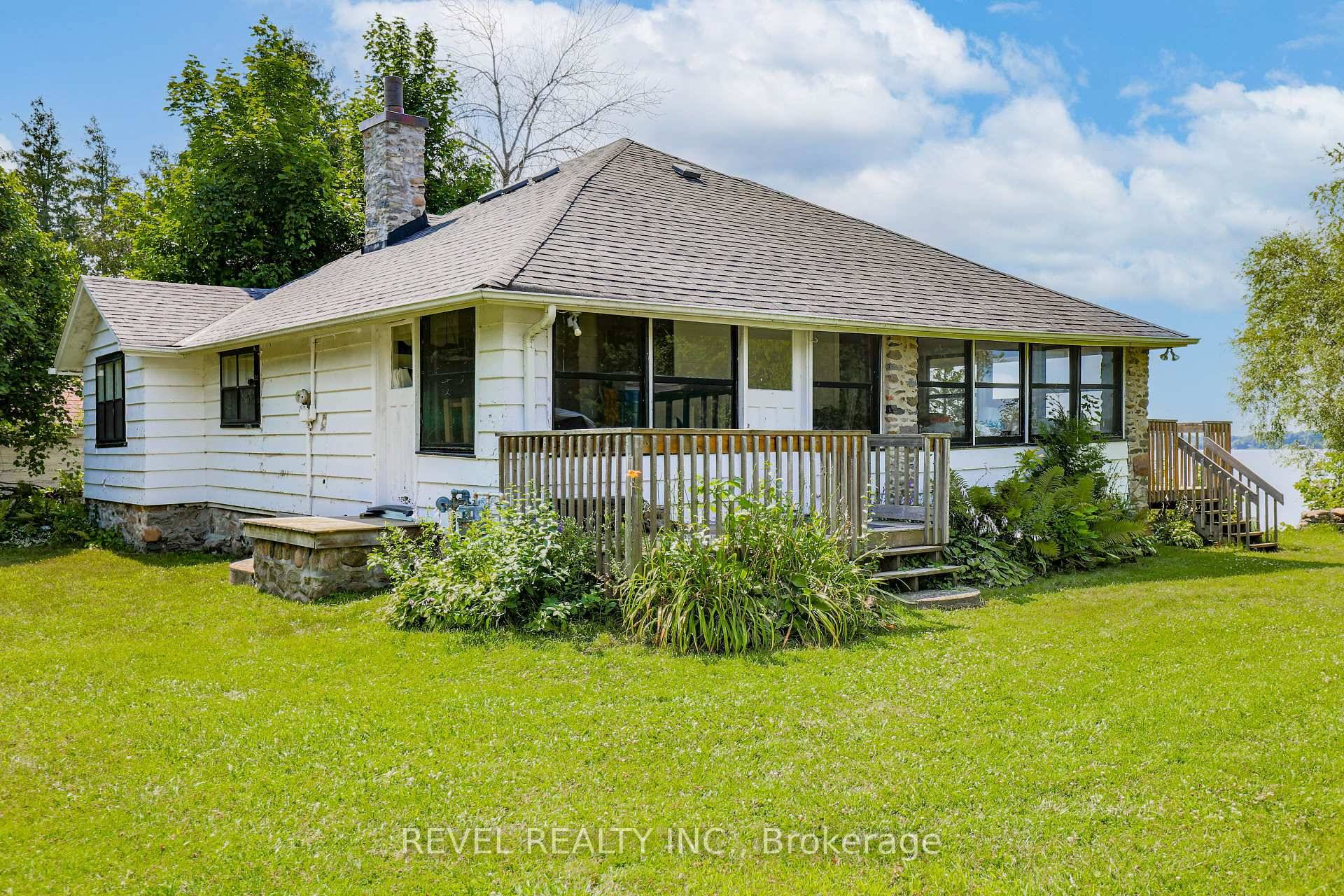 Experience breathtaking sunsets from this charming dwelling nestled on the shores of Lake Scugog.
