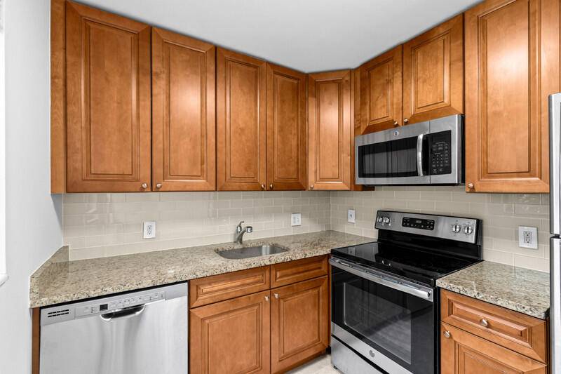 Light, bright, and spacious ground floor inside corner unit in highly desirable Mansfield at Century Village.