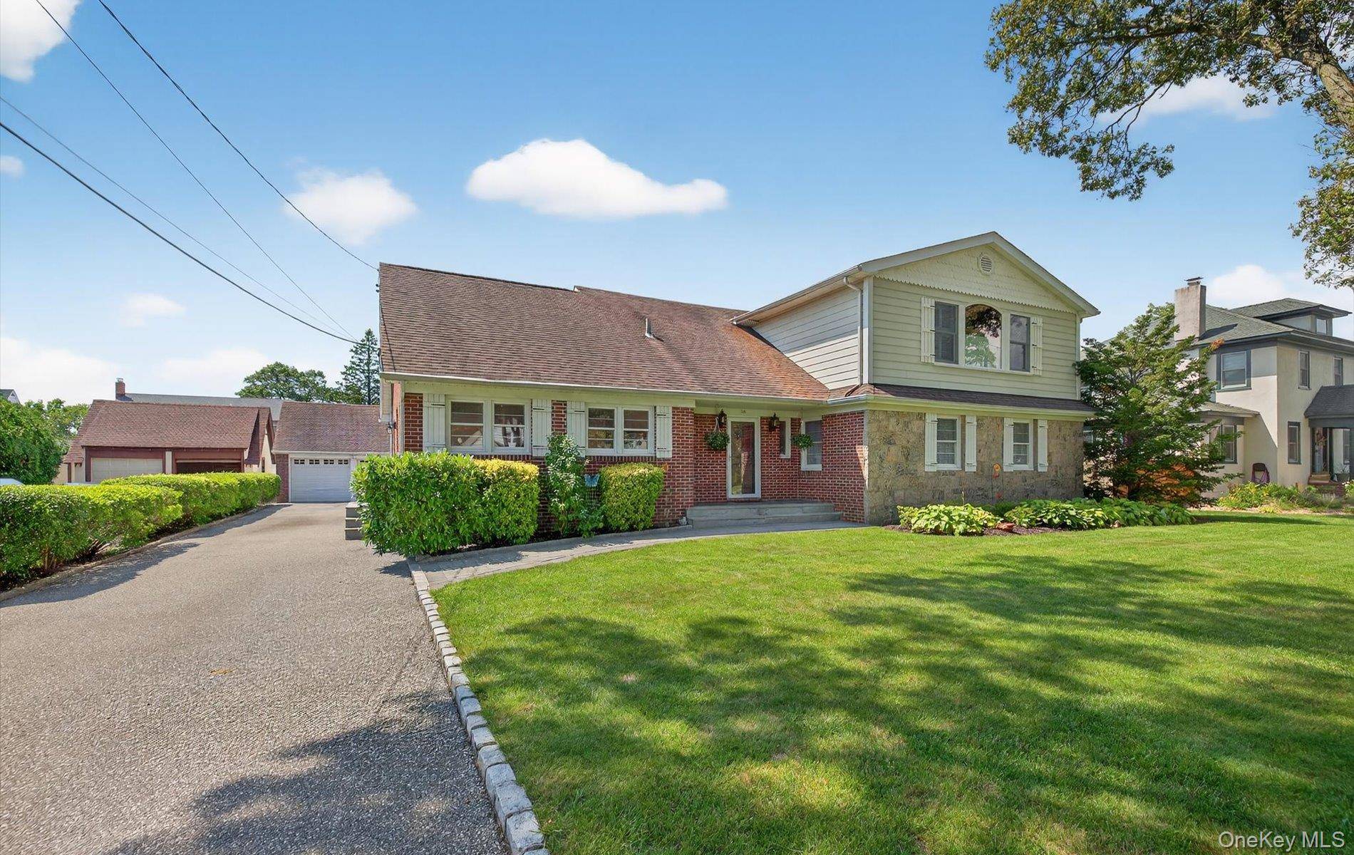 Welcome to 36 Hemlock Lane Located in the Lawrence Farms Section of Bay Shore !